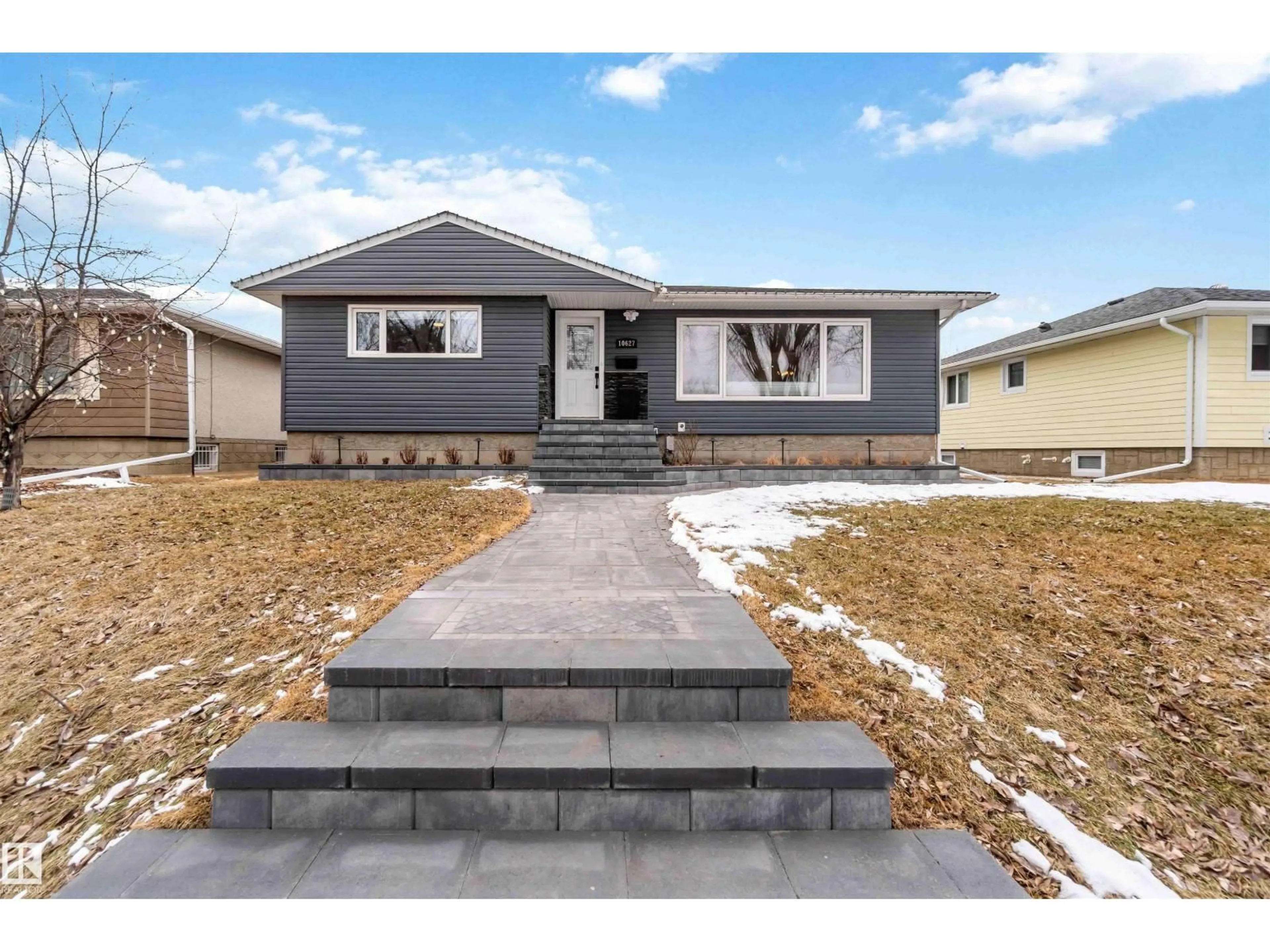 Home with vinyl exterior material, street for 10627 82 ST, Edmonton Alberta T6A3N2