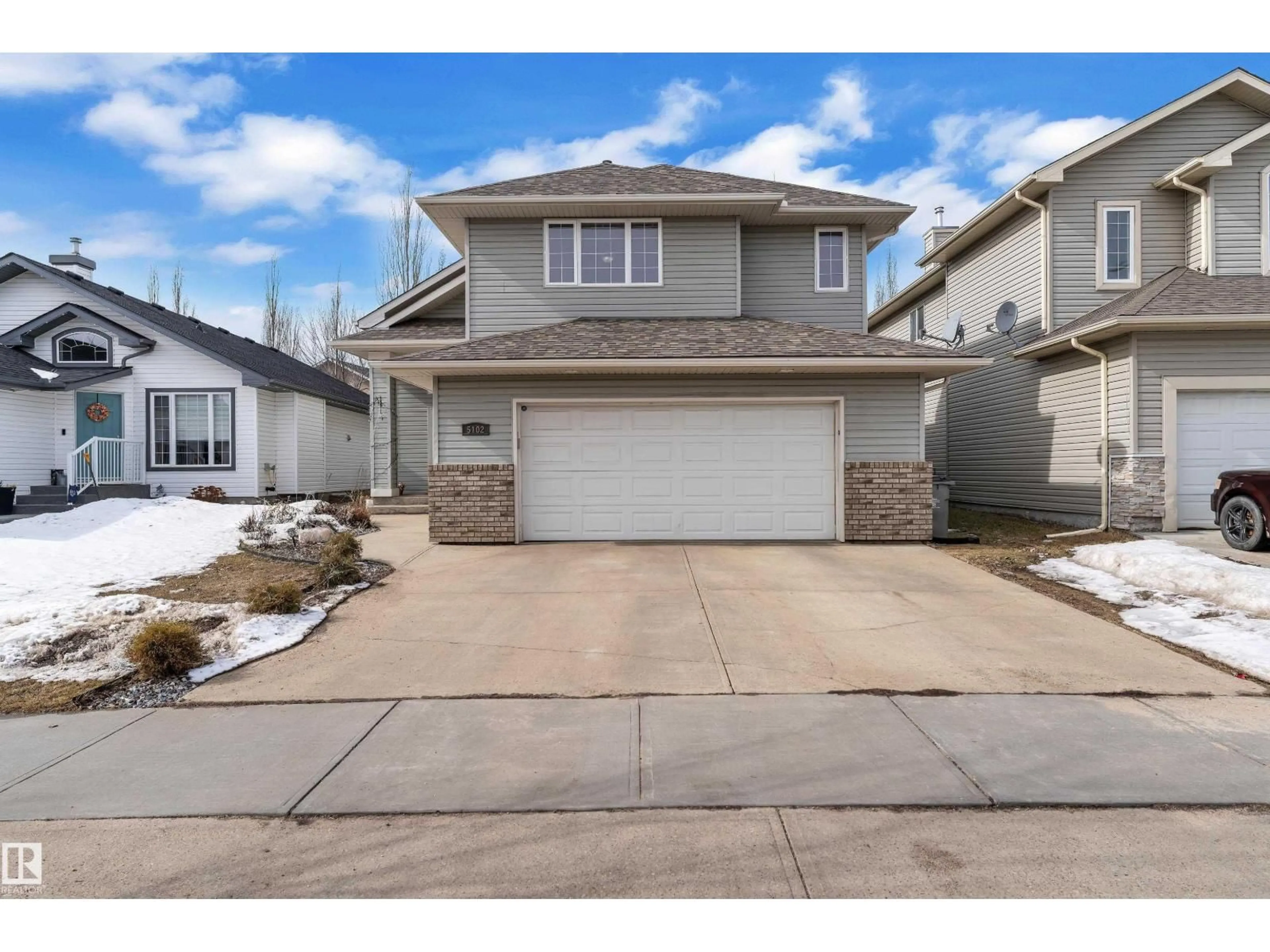 Home with vinyl exterior material, street for 5102 62 ST, Beaumont Alberta T4X1V5