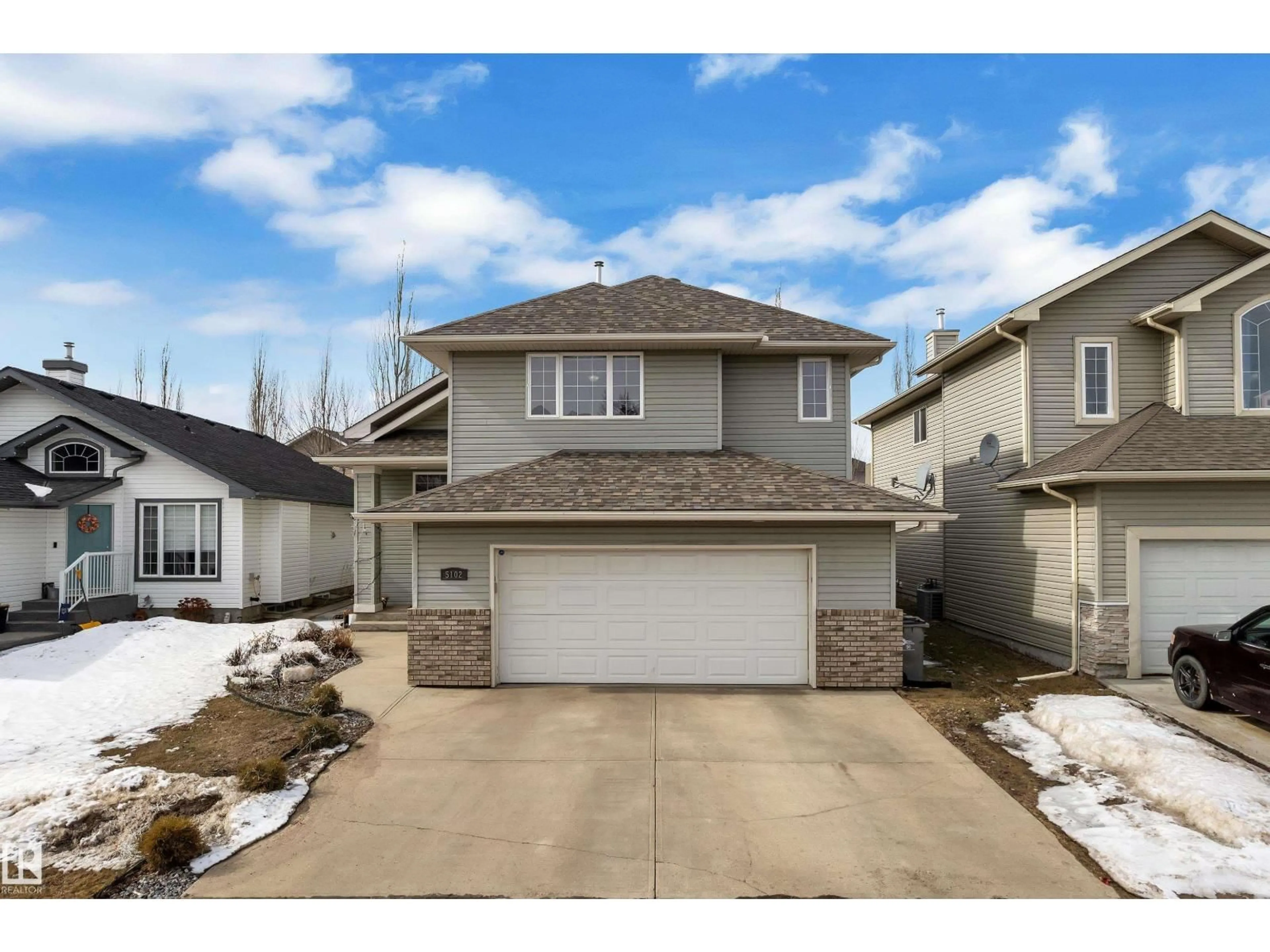 Home with vinyl exterior material, street for 5102 62 ST, Beaumont Alberta T4X1V5