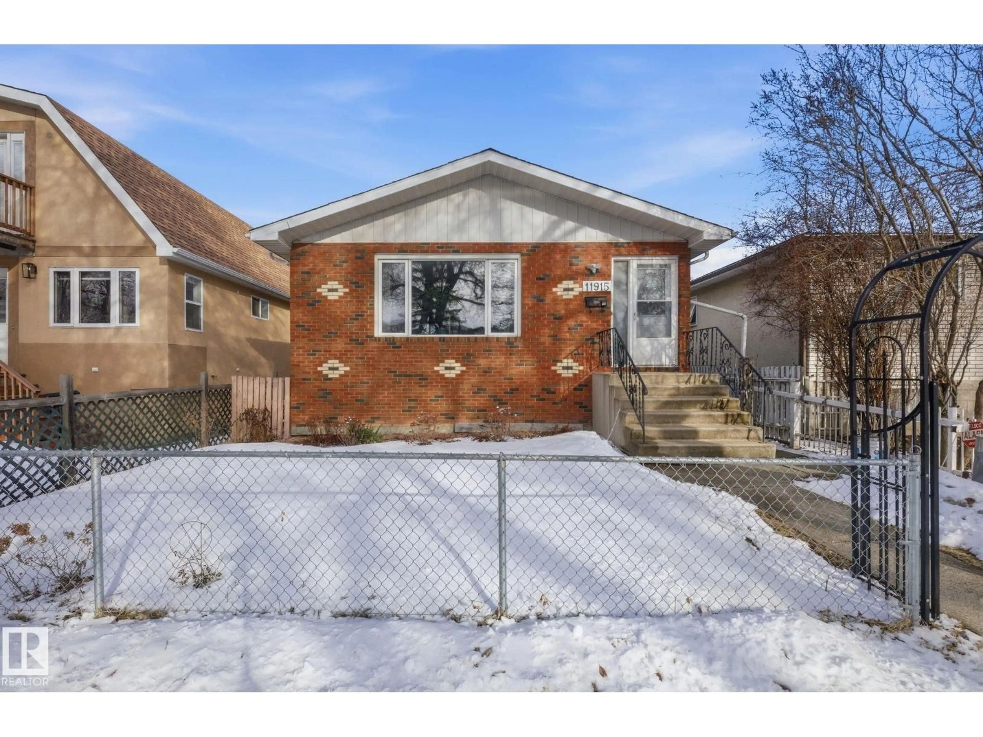 Home with brick exterior material, street for NW - 11915 92 ST, Edmonton Alberta T5G1A7