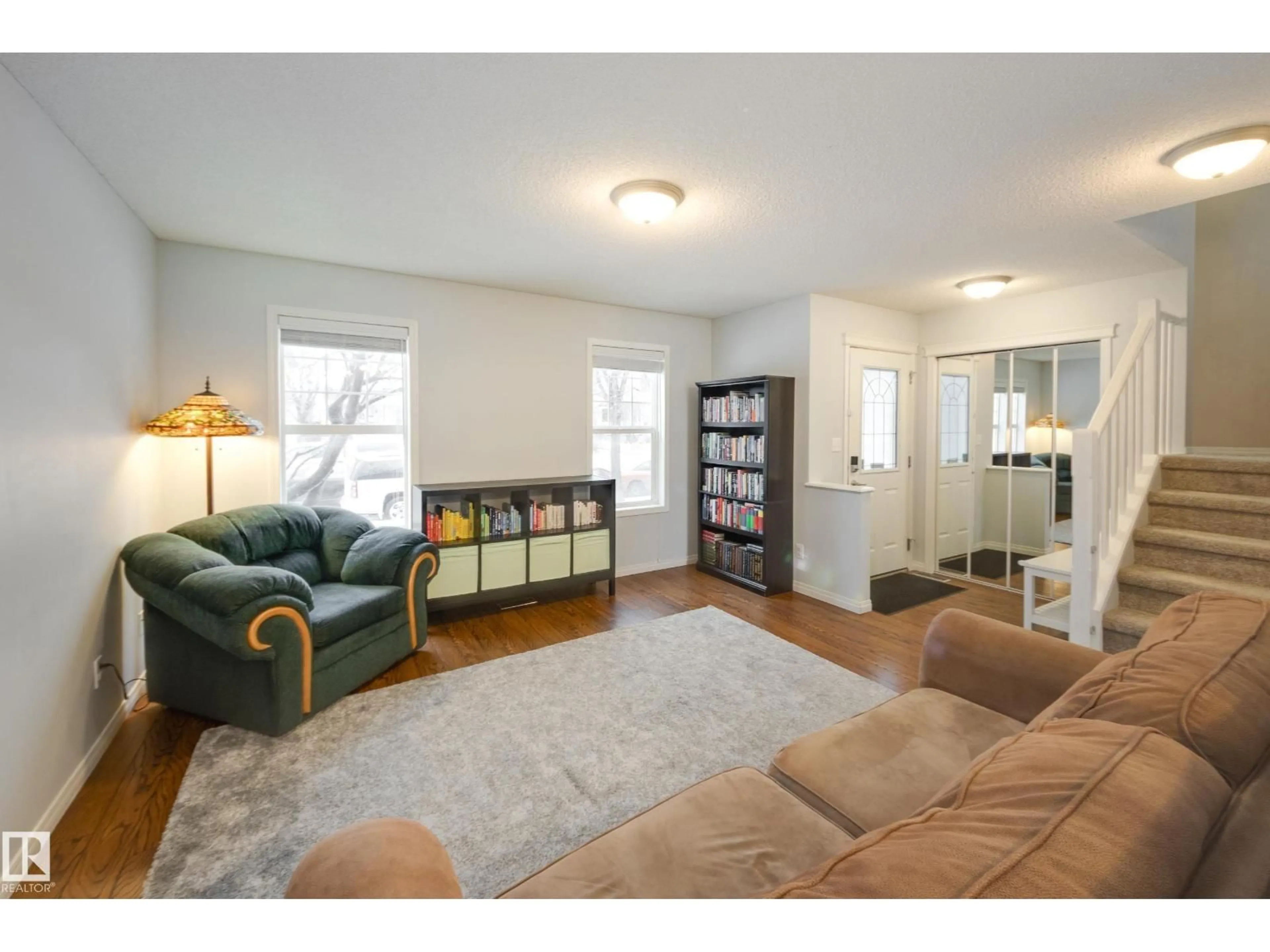 Living room with furniture, wood/laminate floor for 14 SUMMERLAND WY, Sherwood Park Alberta T8H2P3