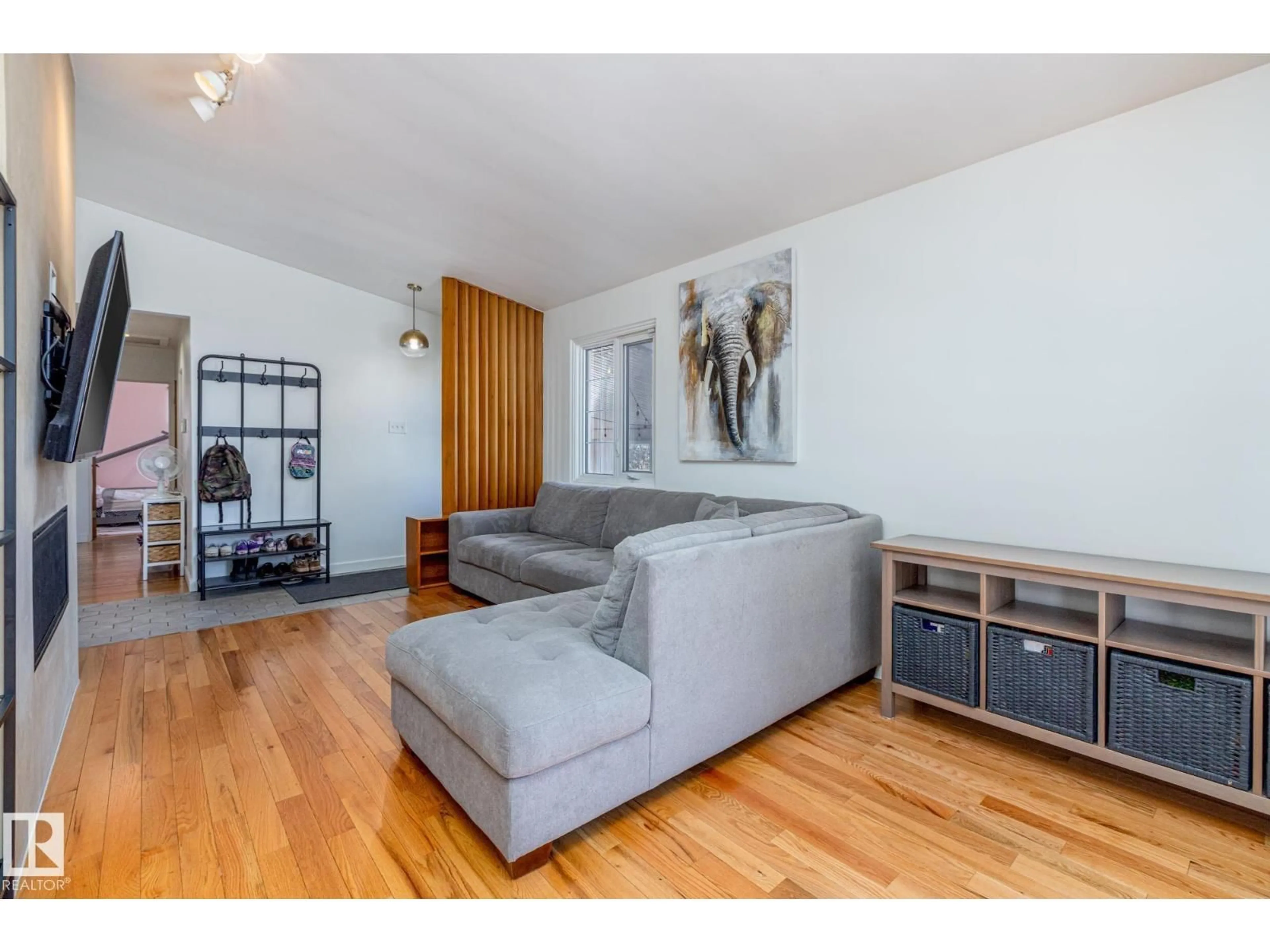 Living room with furniture, wood/laminate floor for 6511 103 AV, Edmonton Alberta T6A0T7