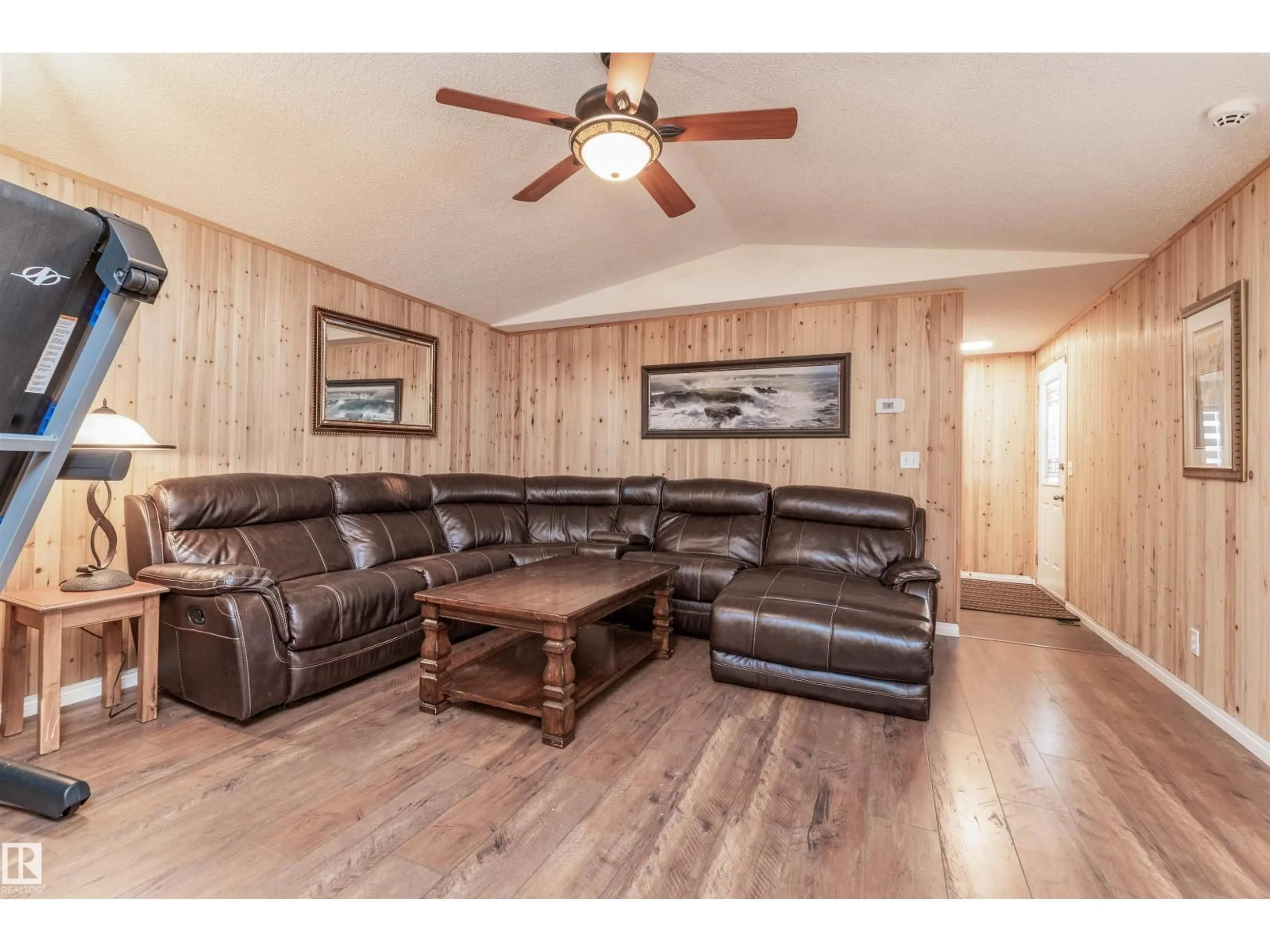 Living room with furniture, wood/laminate floor for 924 JUBILEE CL, Sherwood Park Alberta T8H2G3
