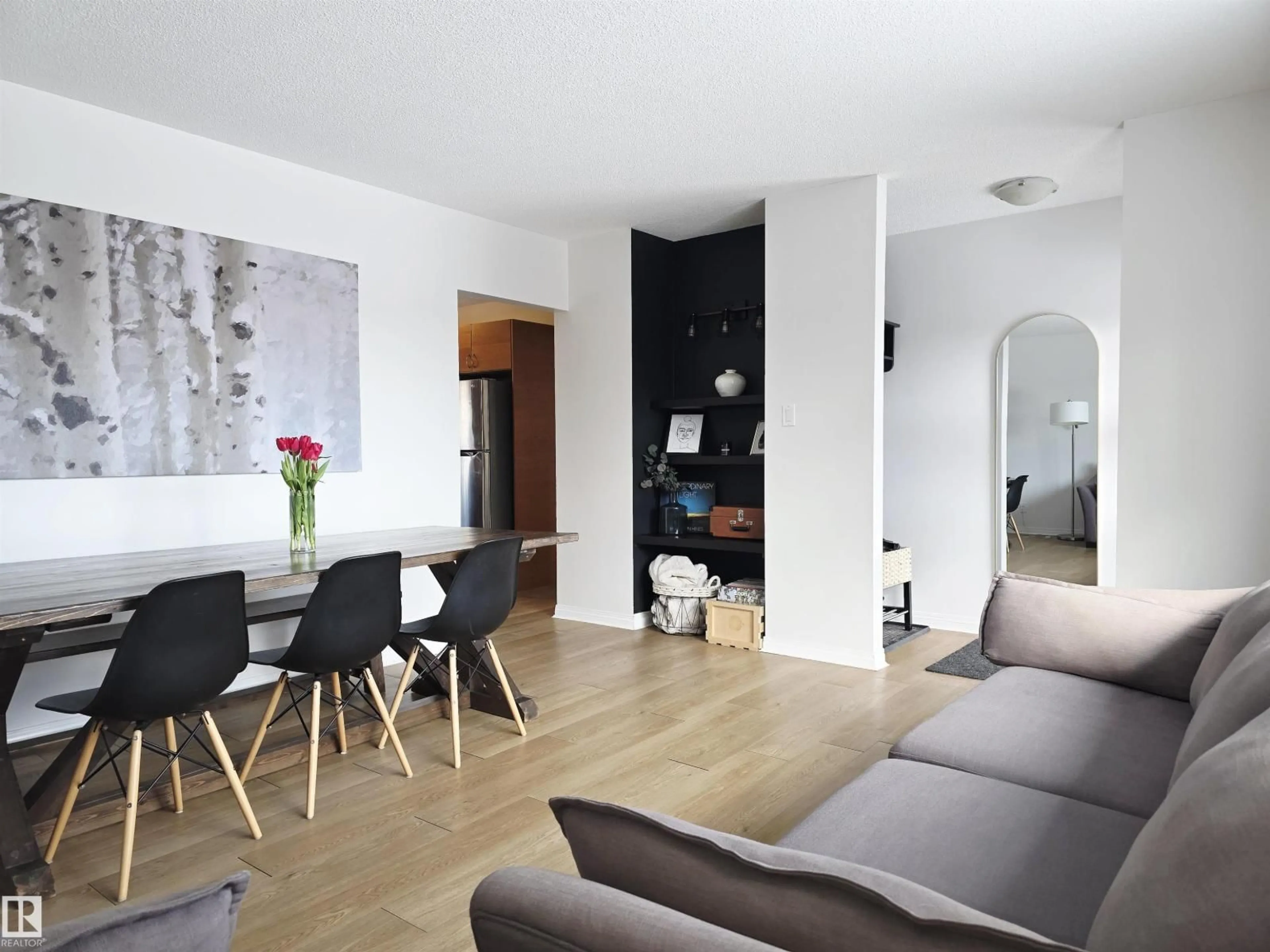 Living room with furniture, wood/laminate floor for NW - 4820 105B ST, Edmonton Alberta T6H2S1