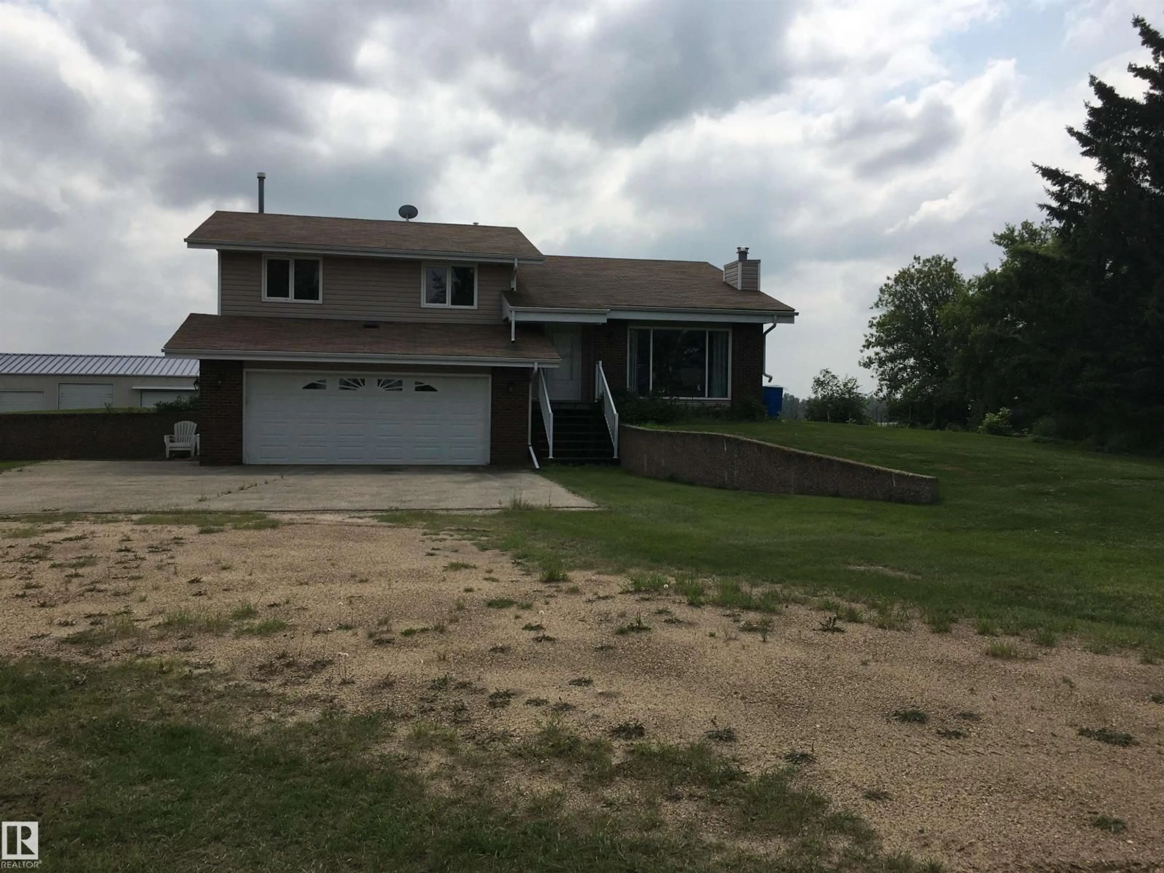 A pic from outside/outdoor area/front of a property/back of a property/a pic from drone, street for 25009 604, Rural Westlock County Alberta T0G0P0