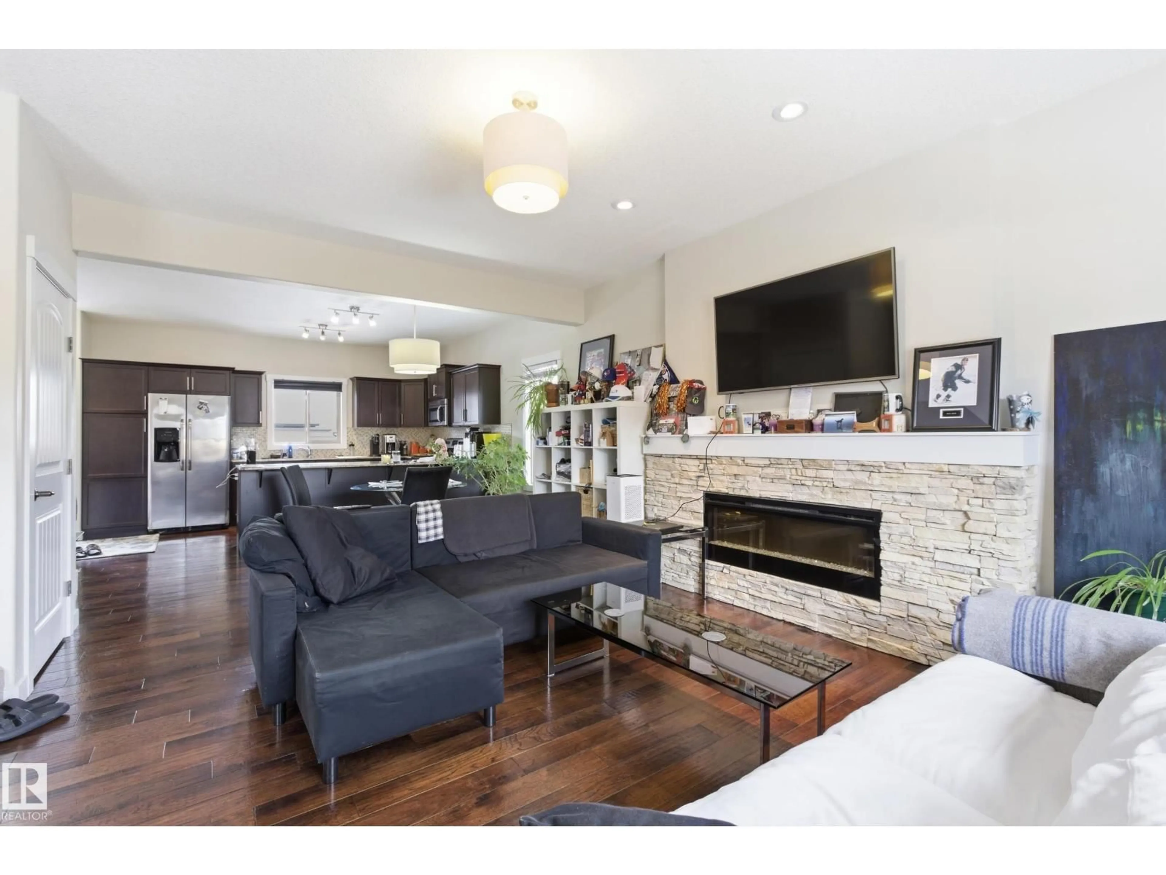 Living room with furniture, wood/laminate floor for 39 GREENBURY BV, Spruce Grove Alberta T7X0A7