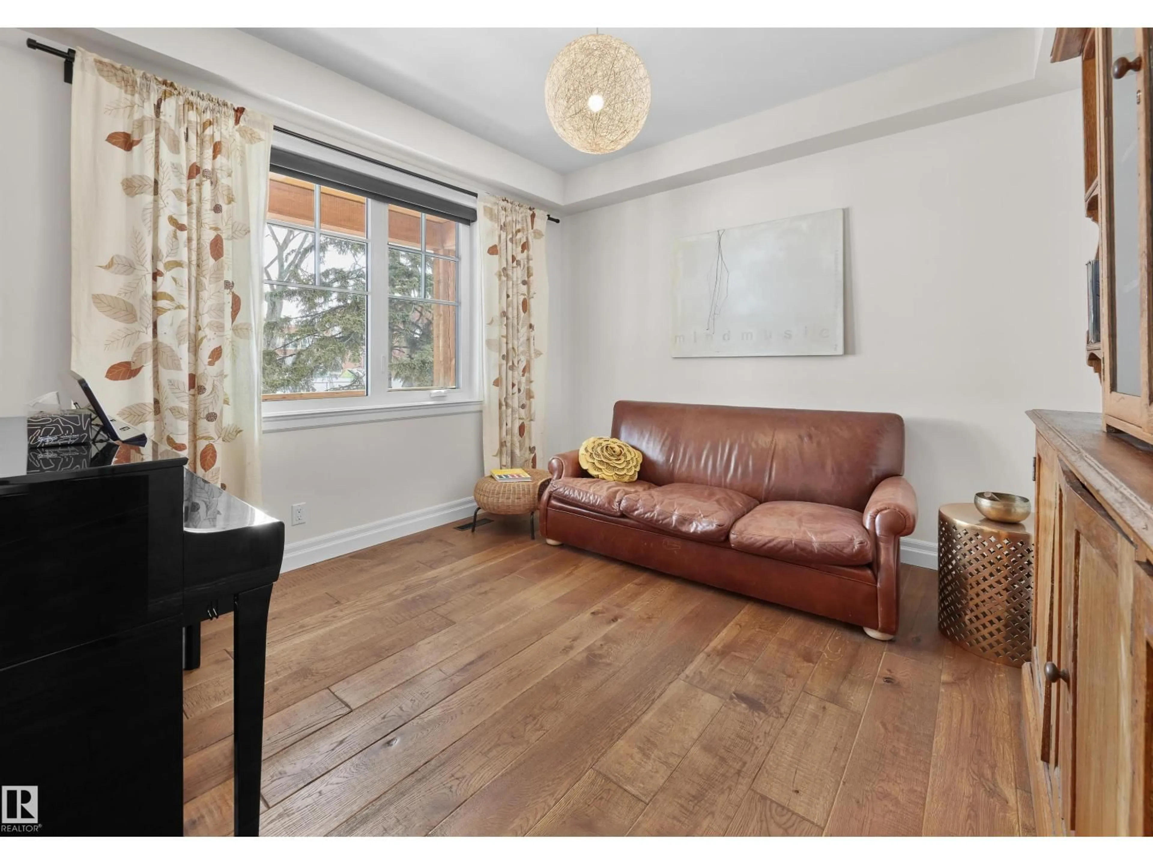 Living room with furniture, wood/laminate floor for 10426 138 ST, Edmonton Alberta T5N2J4