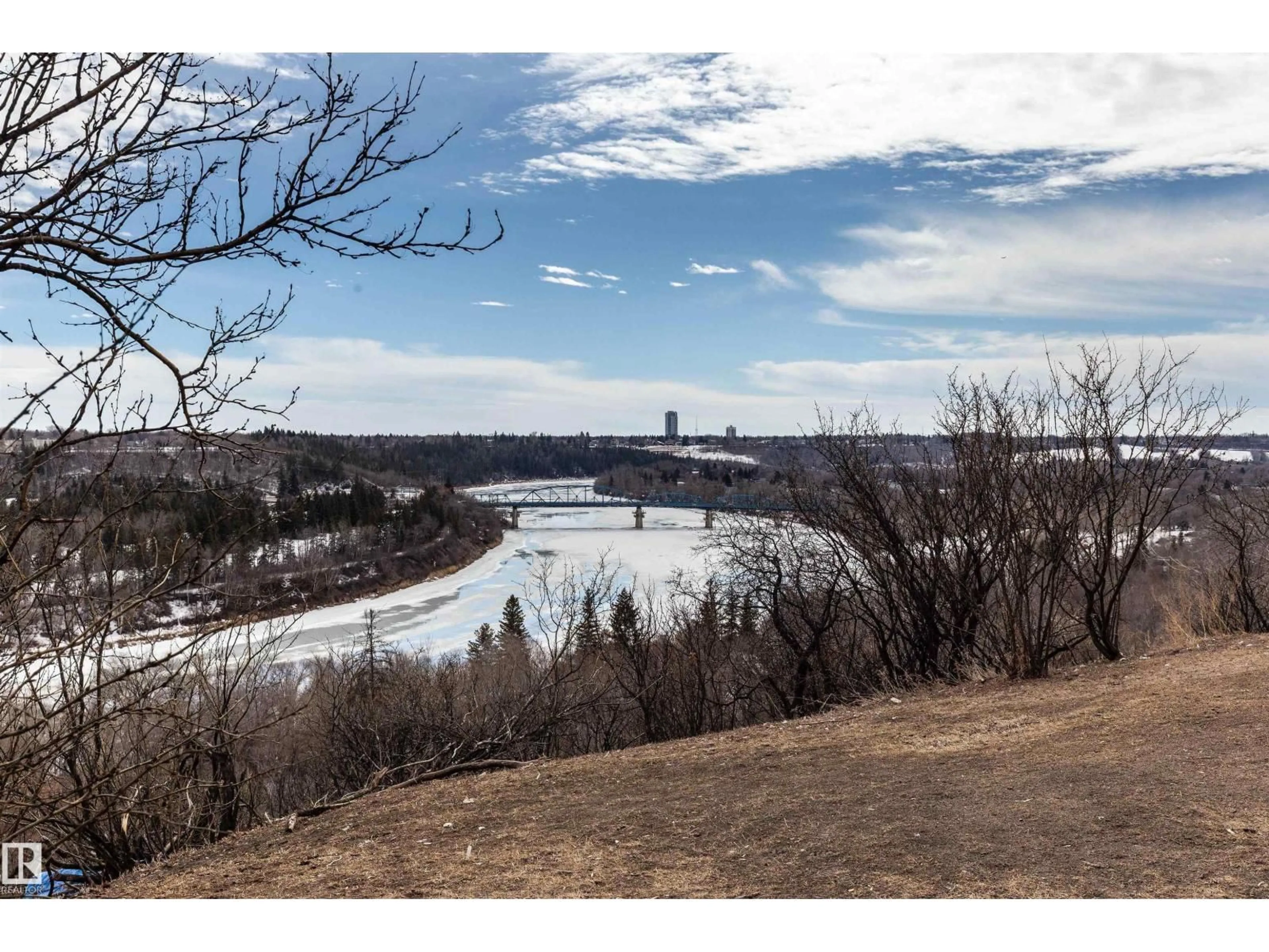 A pic from outside/outdoor area/front of a property/back of a property/a pic from drone, water/lake/river/ocean view for 8340 - 601 JASPER AV, Edmonton Alberta T5H4C6