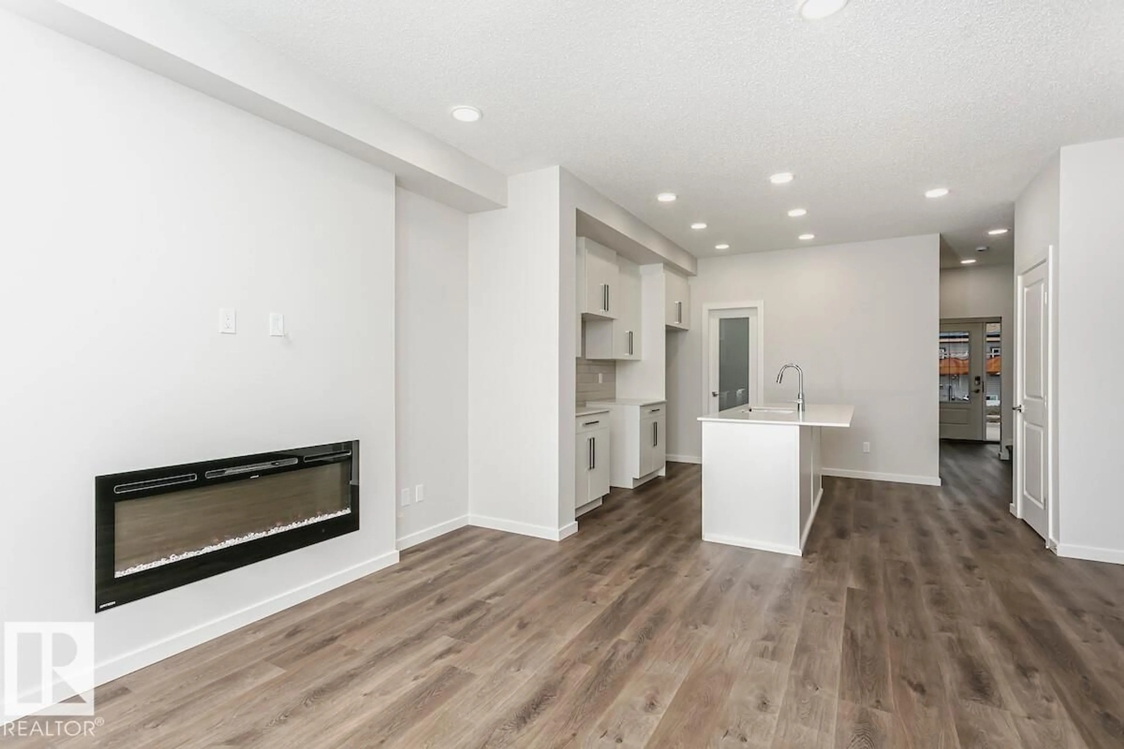 Open concept kitchen, wood/laminate floor for 57 GAMBEL LO, Spruce Grove Alberta T7X0C9