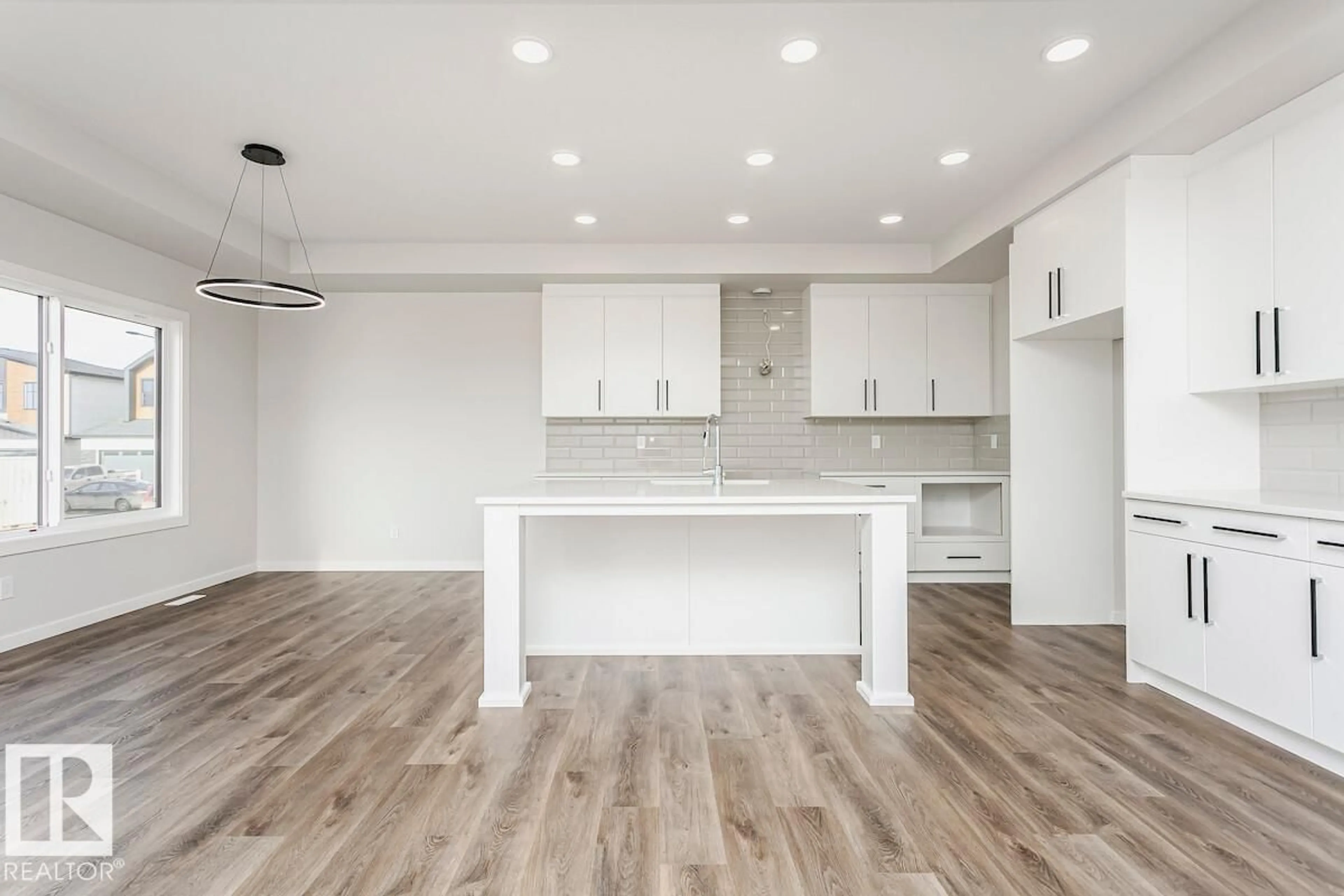 Open concept kitchen, wood/laminate floor for 7624 KIMIWAN CR, Edmonton Alberta T6W1A5
