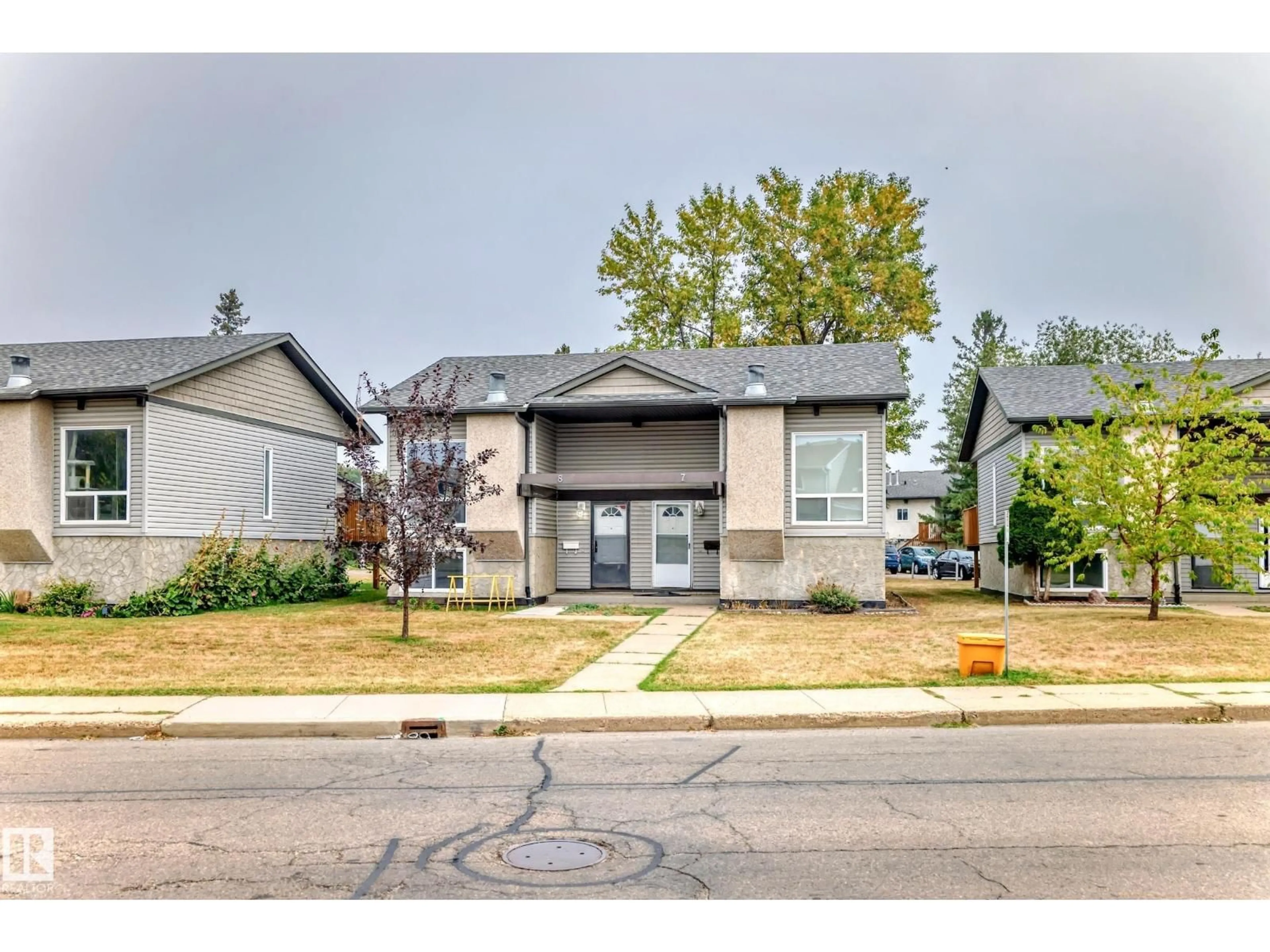 Home with vinyl exterior material, street for 8 NORTHWOODS VG NW, Edmonton Alberta T5X1T2