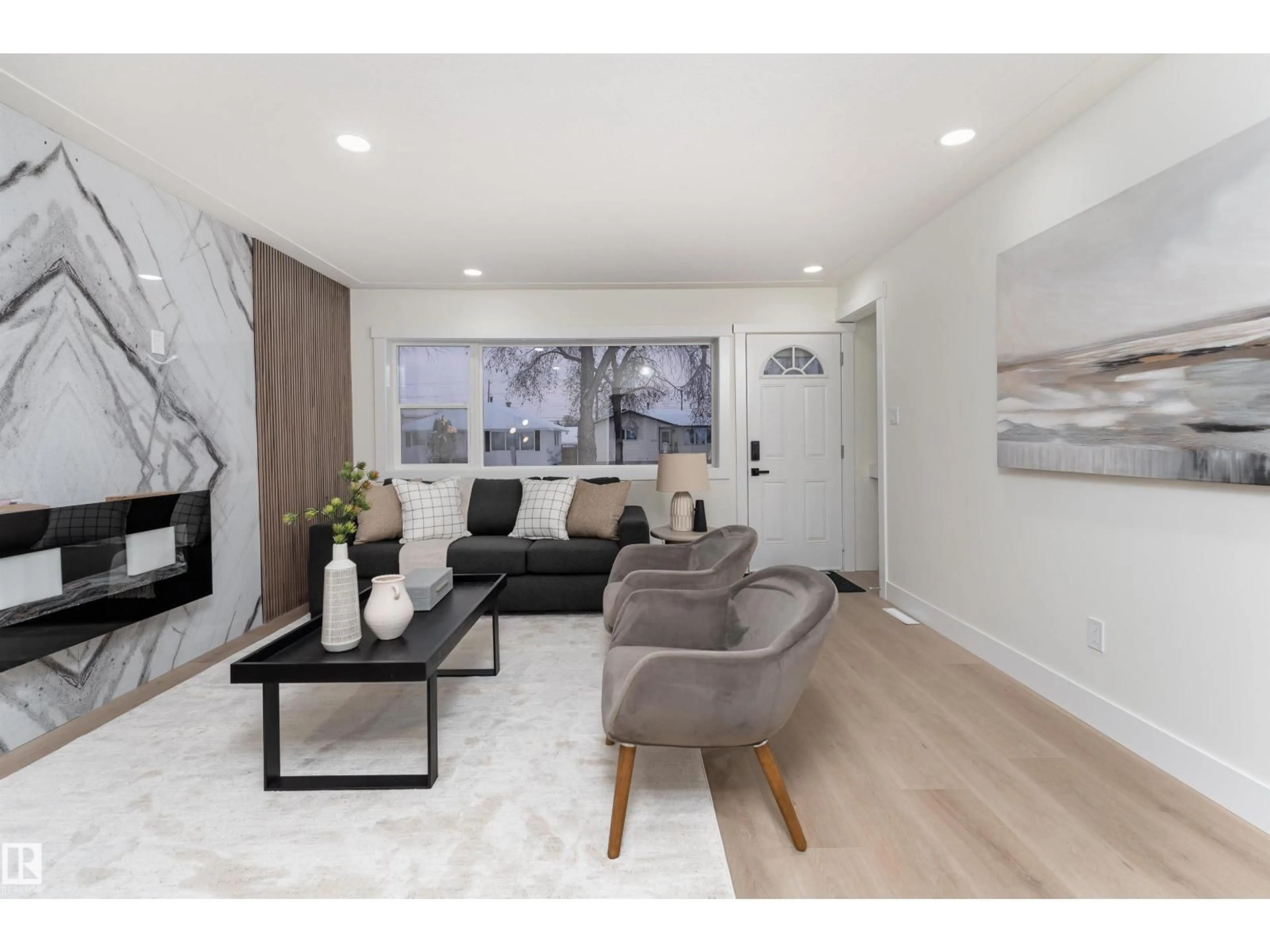 Living room with furniture, wood/laminate floor for 12220 51 ST, Edmonton Alberta T5W3H2