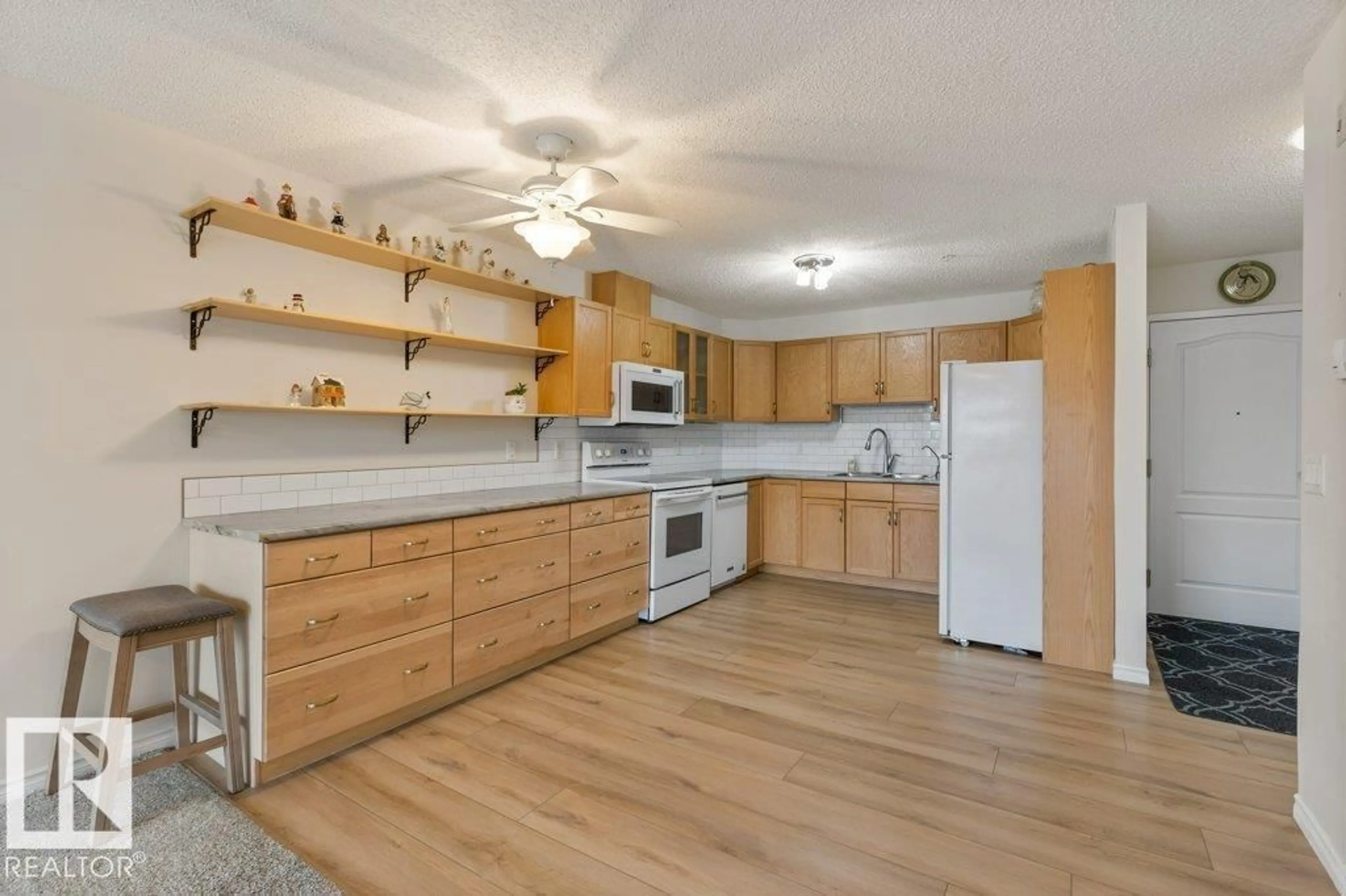Open concept kitchen, wood/laminate floor for 238 - 2741 55 ST, Edmonton Alberta T6L7G7