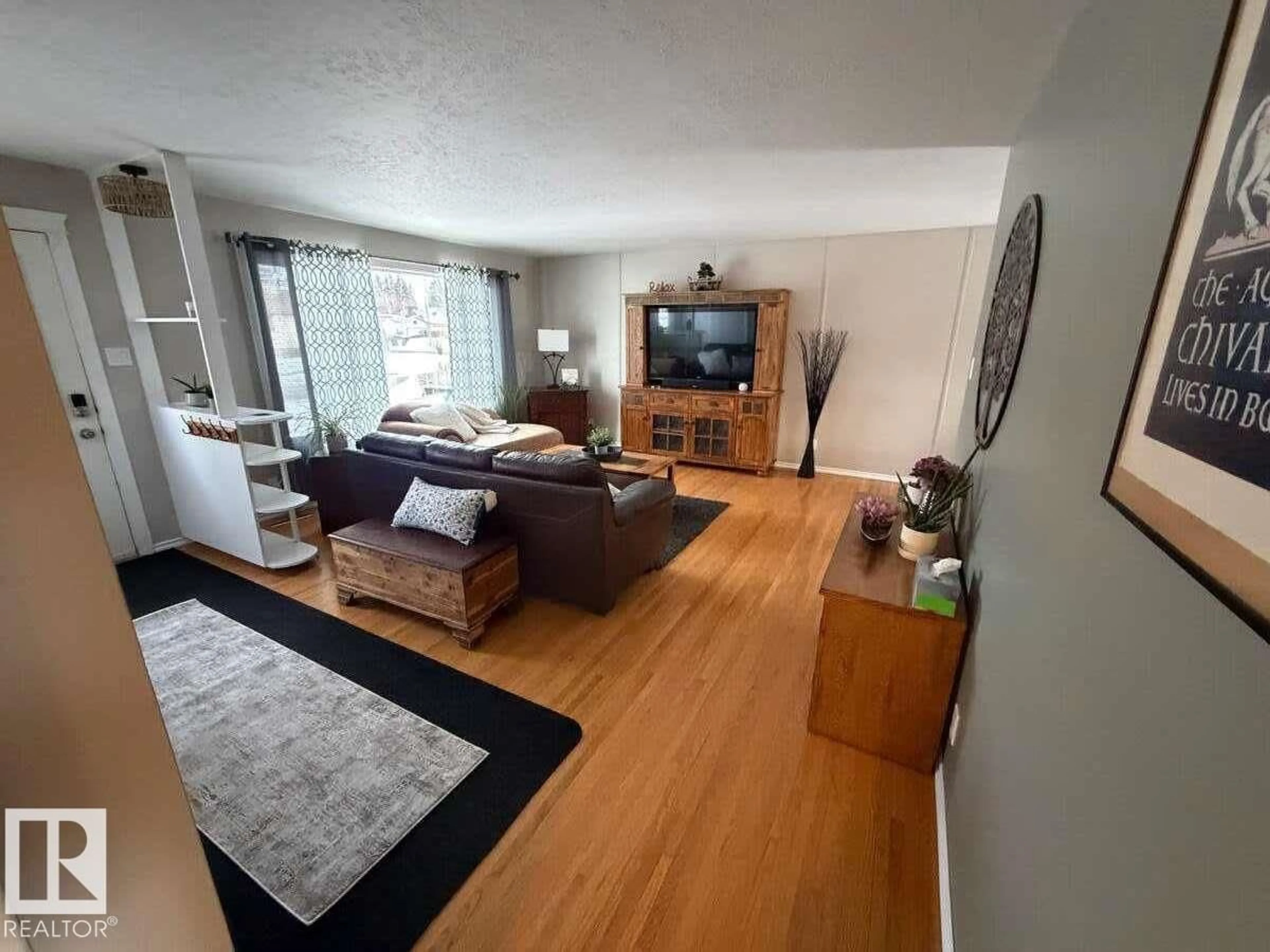 Living room with furniture, unknown for 9906 102 ST, Morinville Alberta T8R1E7