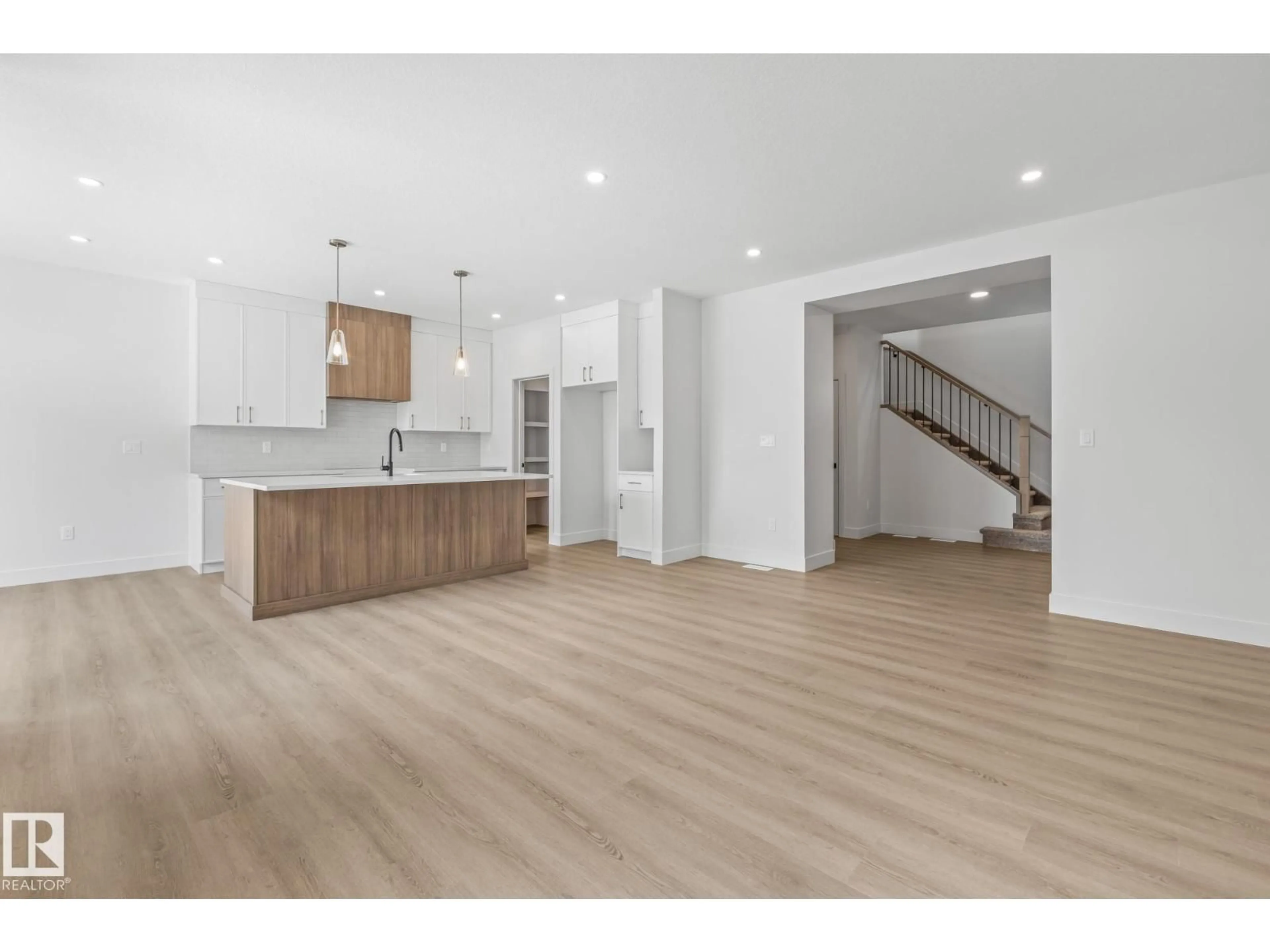 Open concept kitchen, wood/laminate floor for 9624 89A STREET, Morinville Alberta T8R2R6