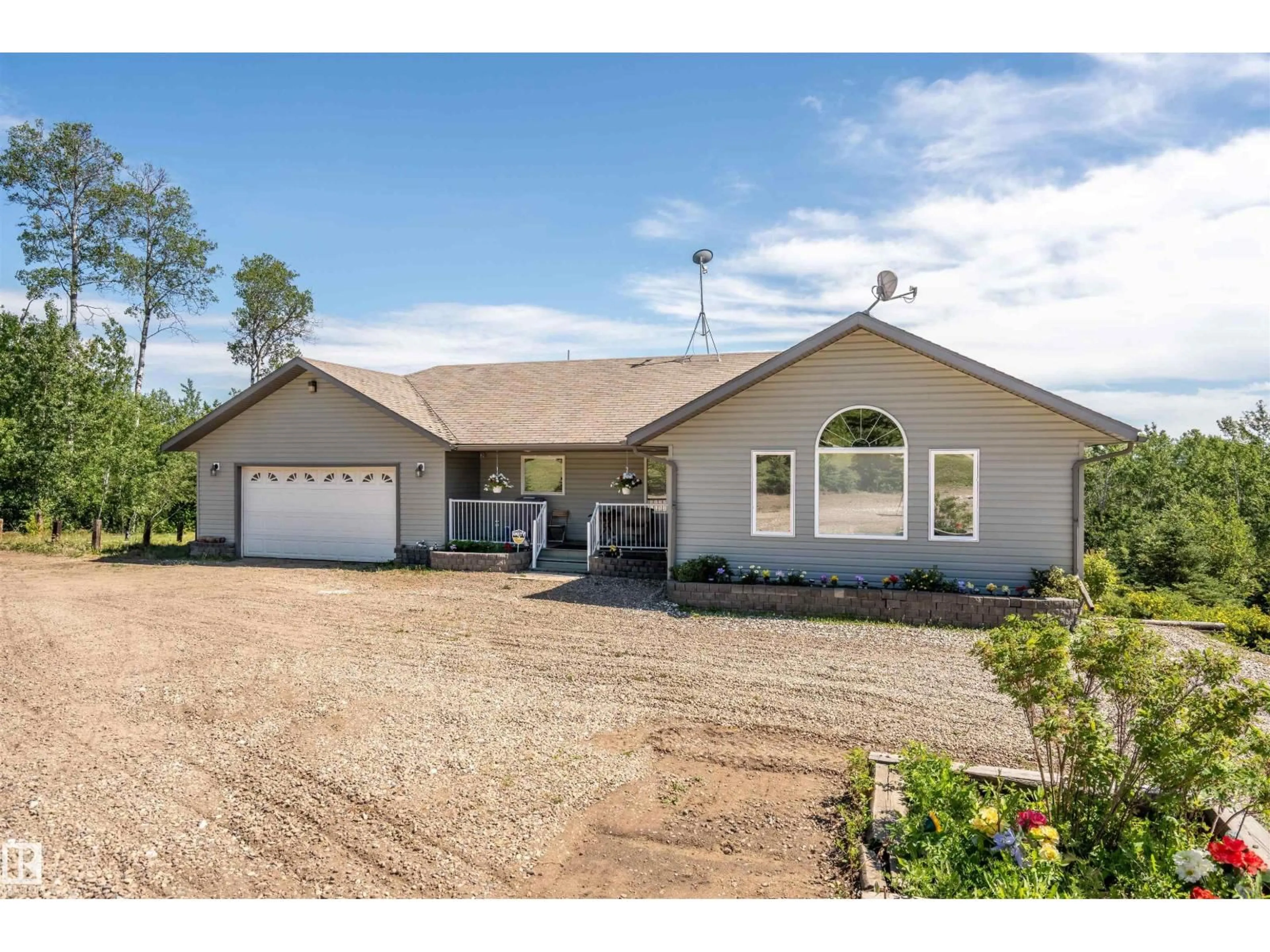 Home with vinyl exterior material, street for 62019 RANGE ROAD 421, Rural Bonnyville M.D. Alberta T9M1P2