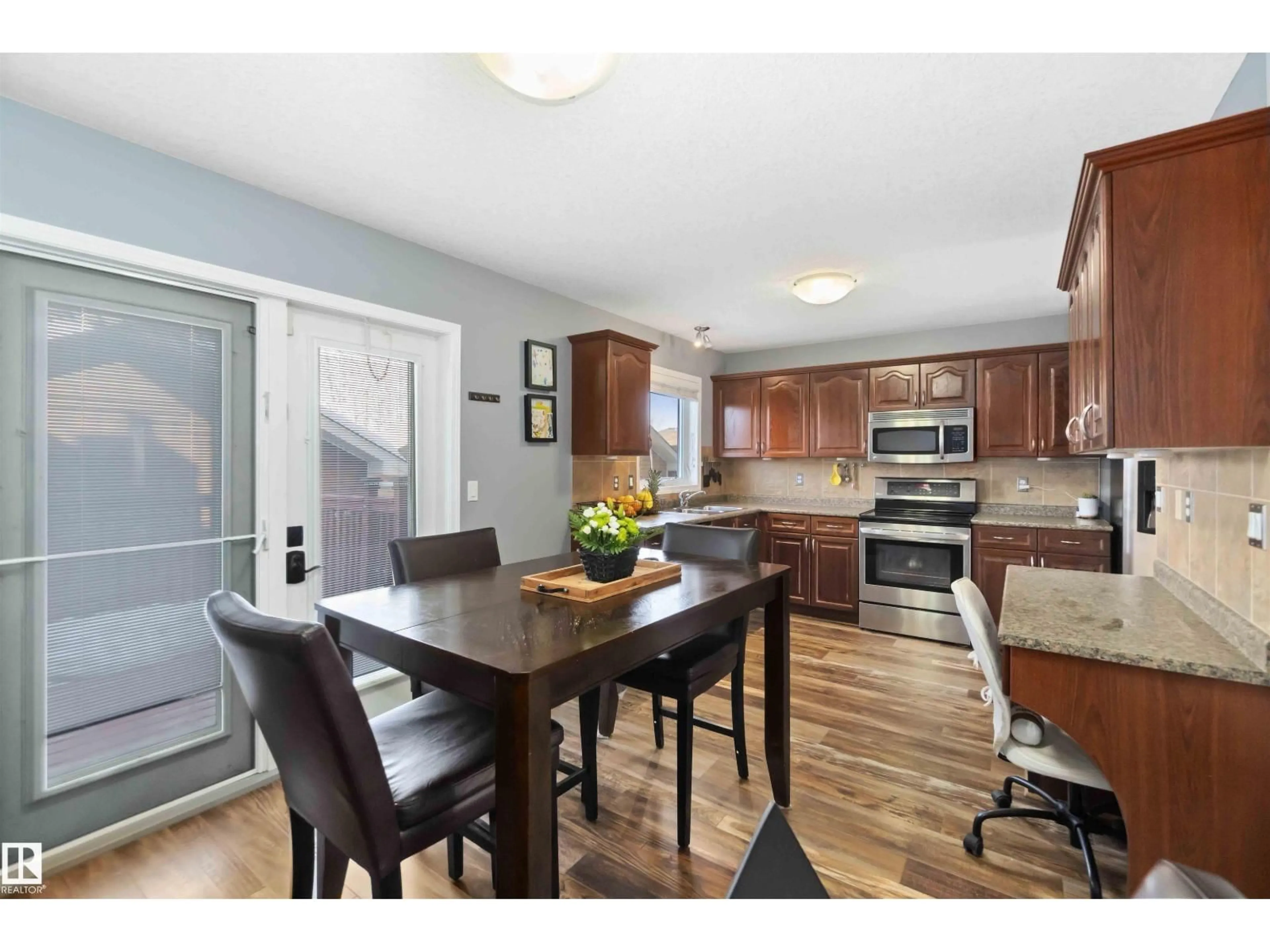 Open concept kitchen, wood/laminate floor for 3818 53 ST, Gibbons Alberta T0A1N0