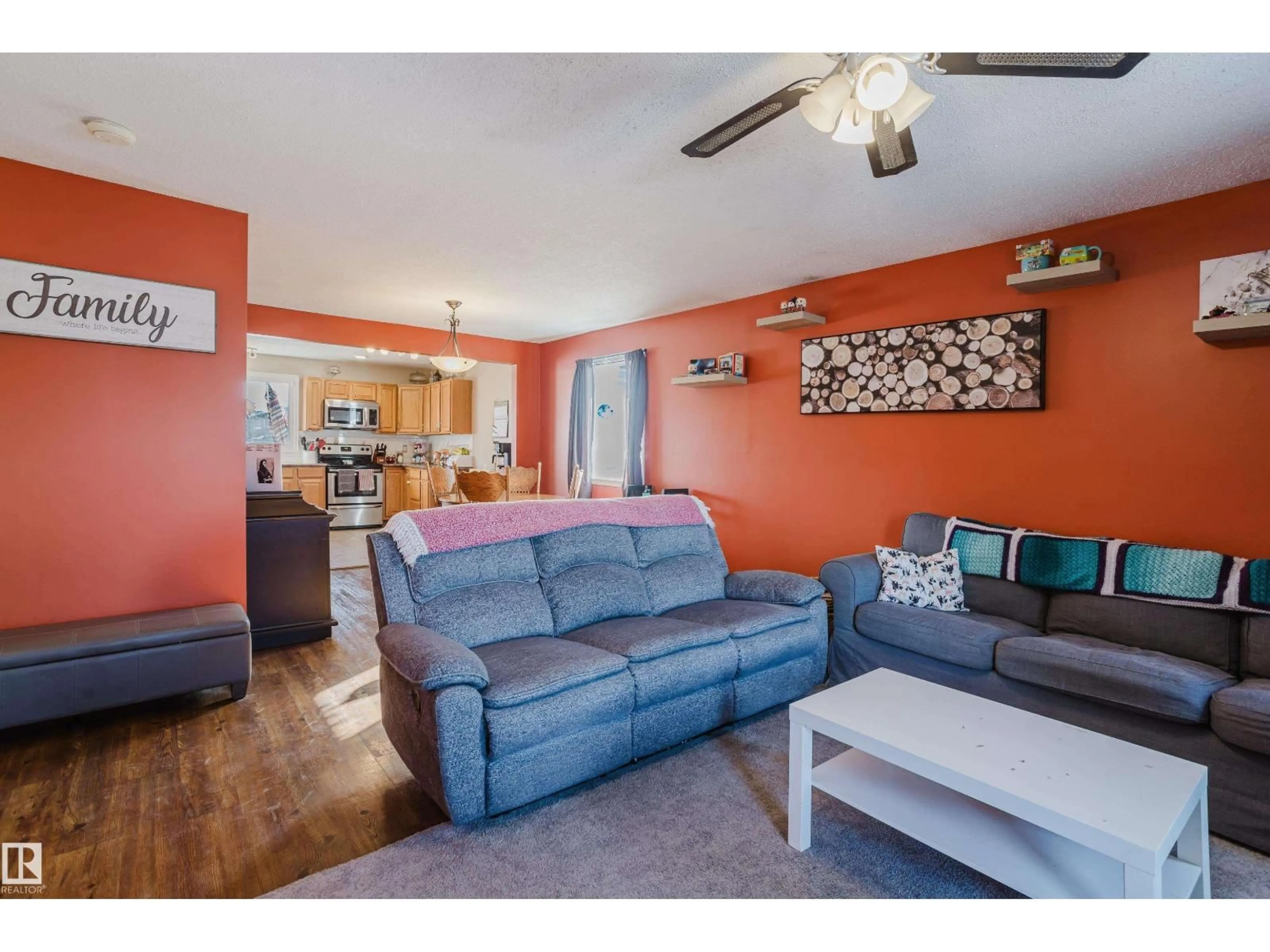 Living room with furniture, wood/laminate floor for NW - 8707 151 AV, Edmonton Alberta T5E5Y1