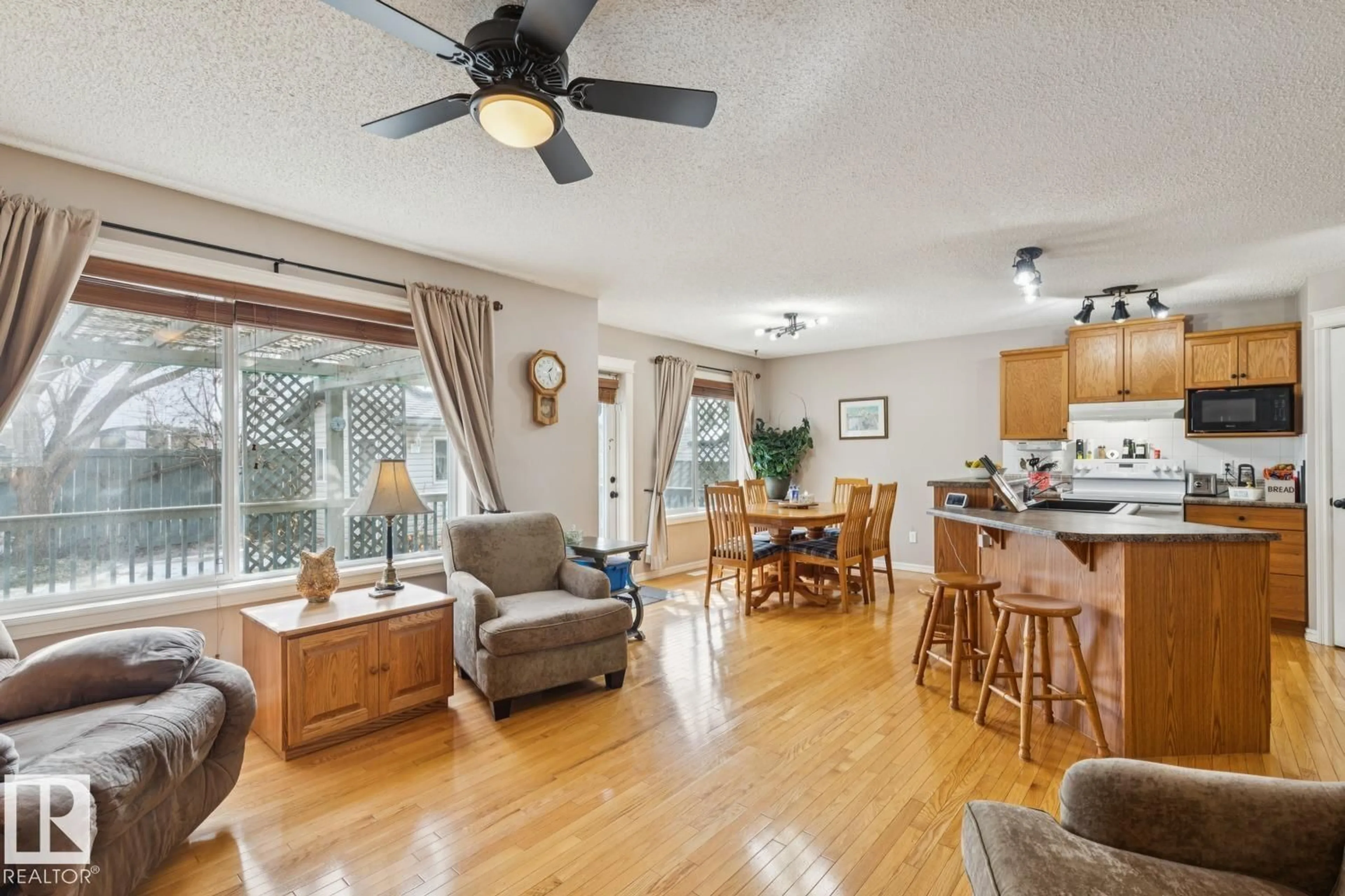 Open concept kitchen, wood/laminate floor for 8761 5 AV SW, Edmonton Alberta T6X1E2