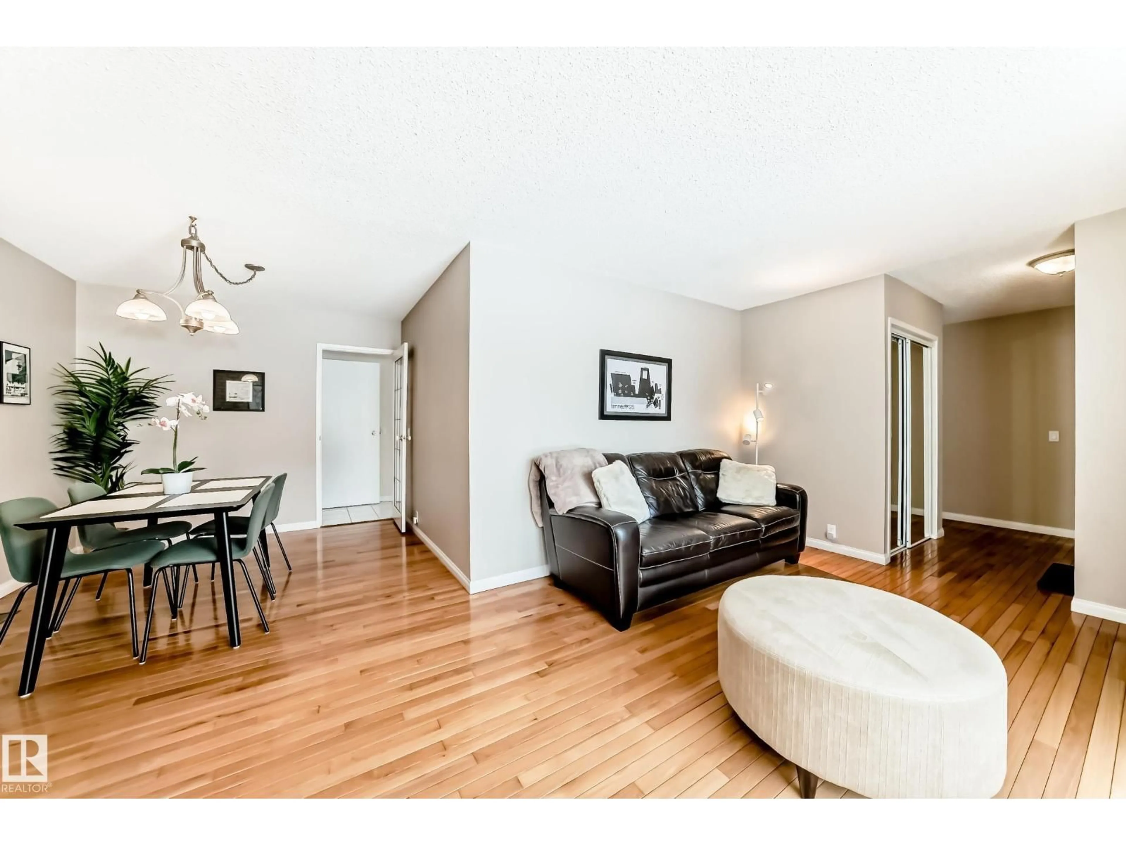 Living room with furniture, wood/laminate floor for 11415 32 AV, Edmonton Alberta T6J3G5