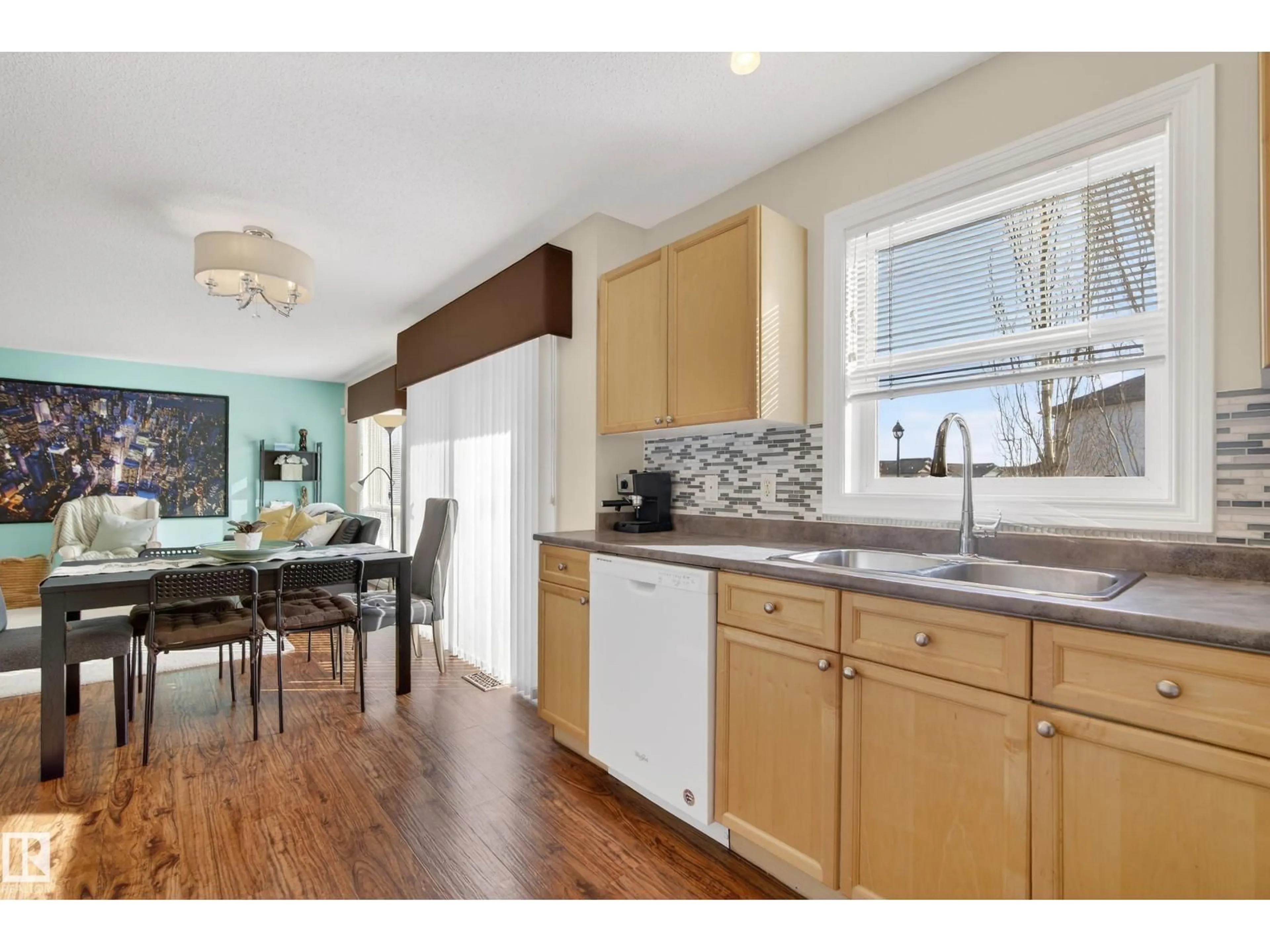 Open concept kitchen, wood/laminate floor for #88 - 12050 17 AV, Edmonton Alberta T6W1X4