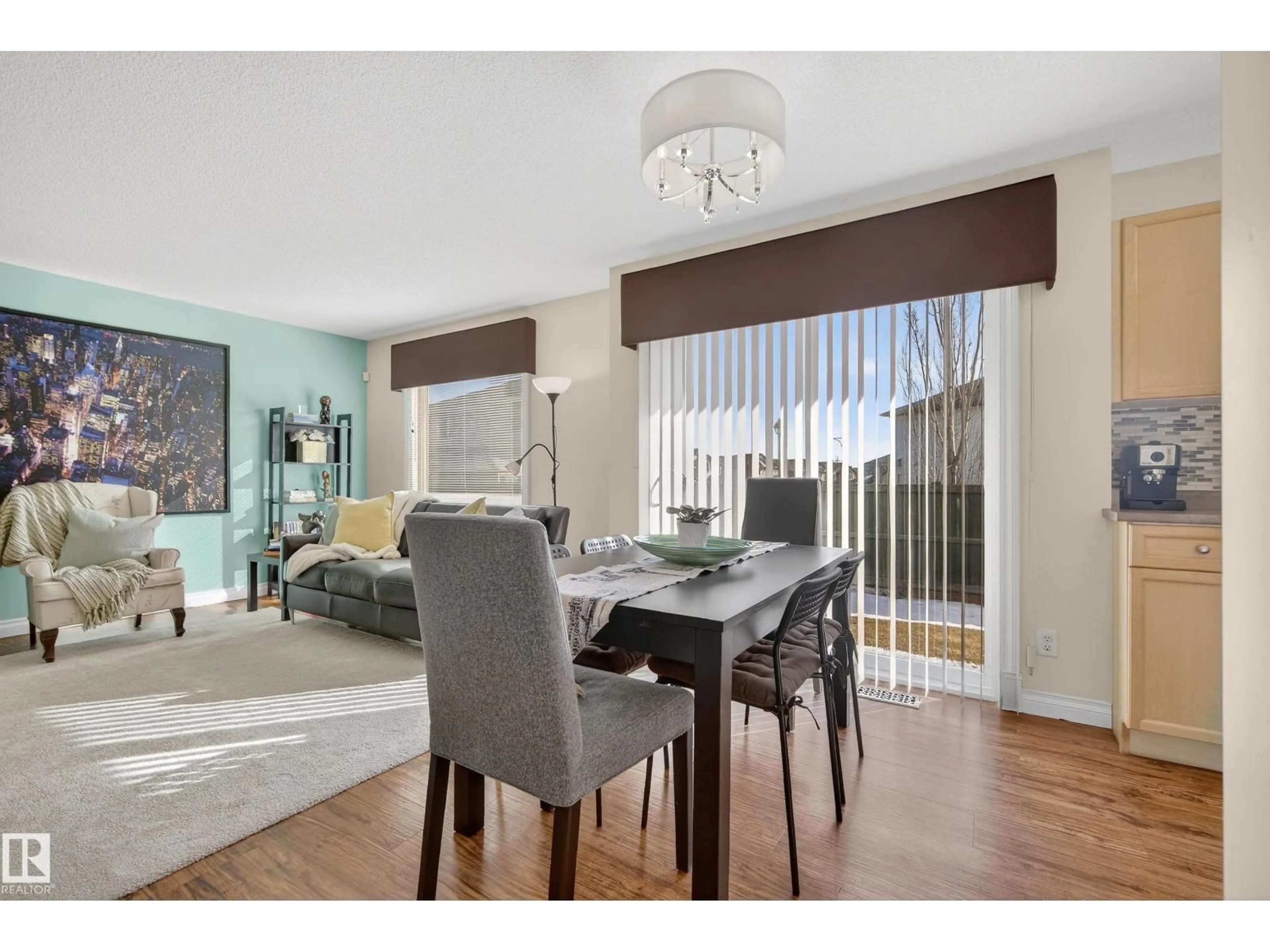 Dining room, wood/laminate floor for #88 - 12050 17 AV, Edmonton Alberta T6W1X4