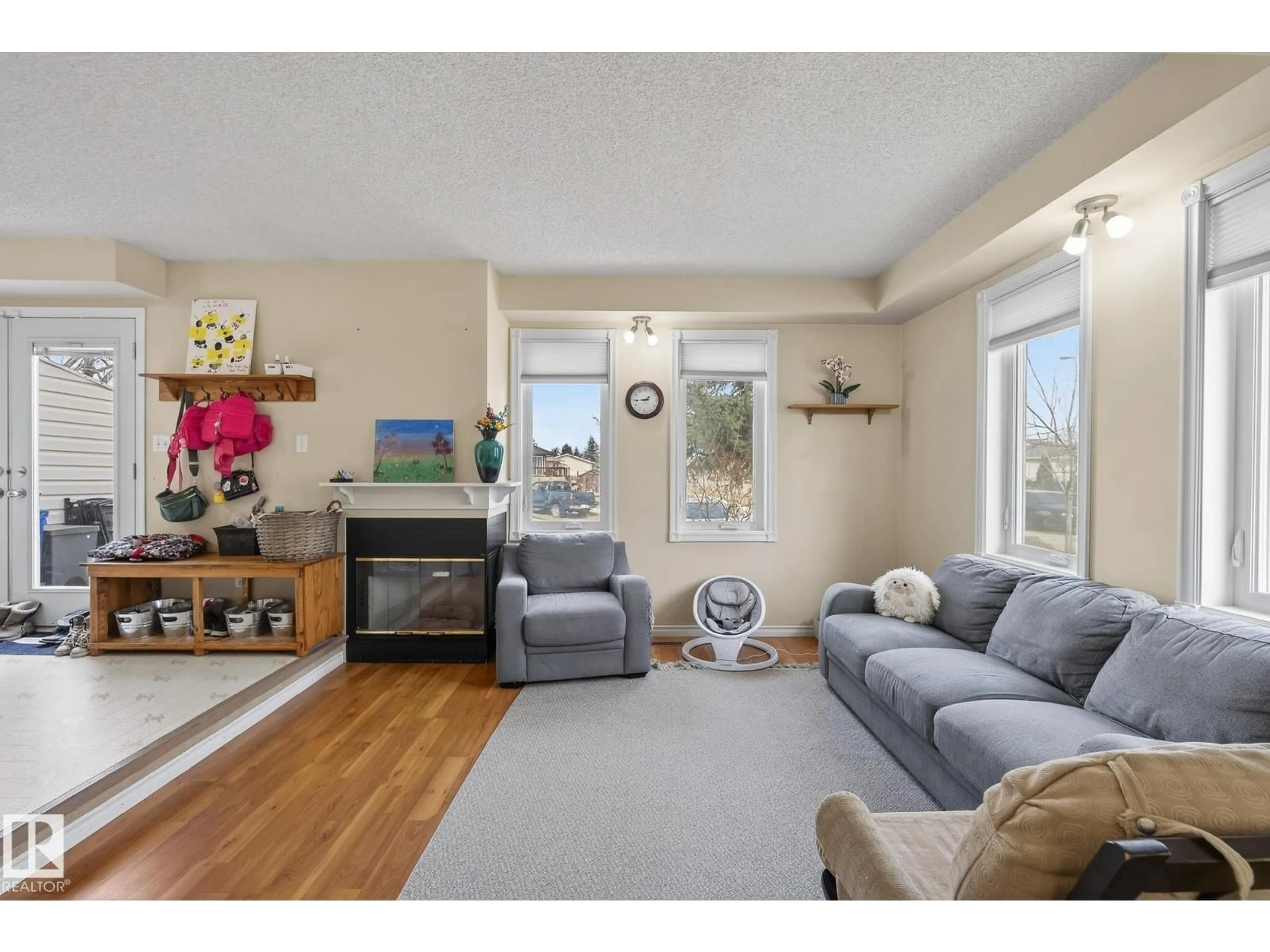 Living room with furniture, wood/laminate floor for 2006 MILL WOODS RD E, Edmonton Alberta T6L6M2