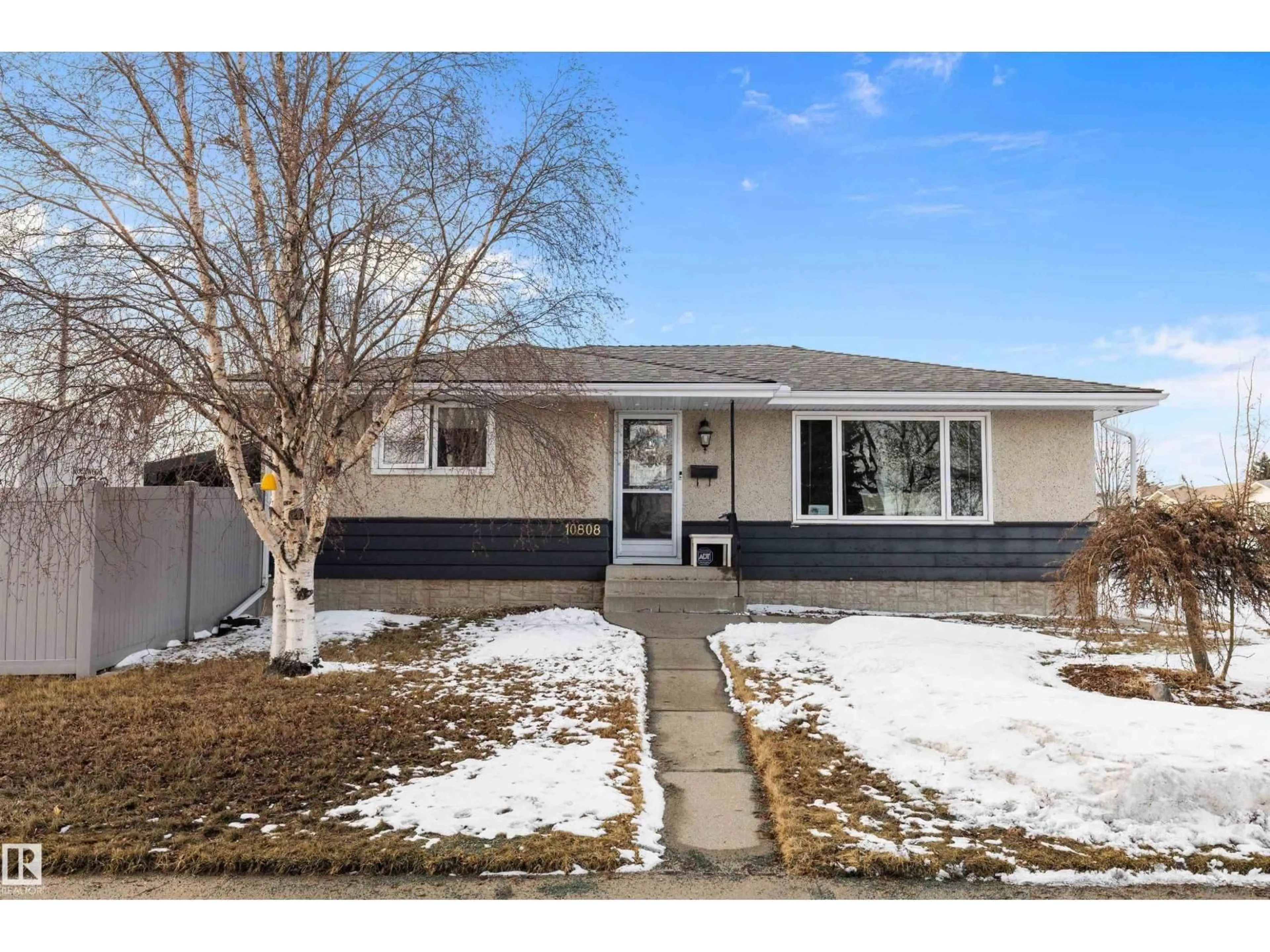 Home with vinyl exterior material, street for 10808 34 ST, Edmonton Alberta T5W1Y4