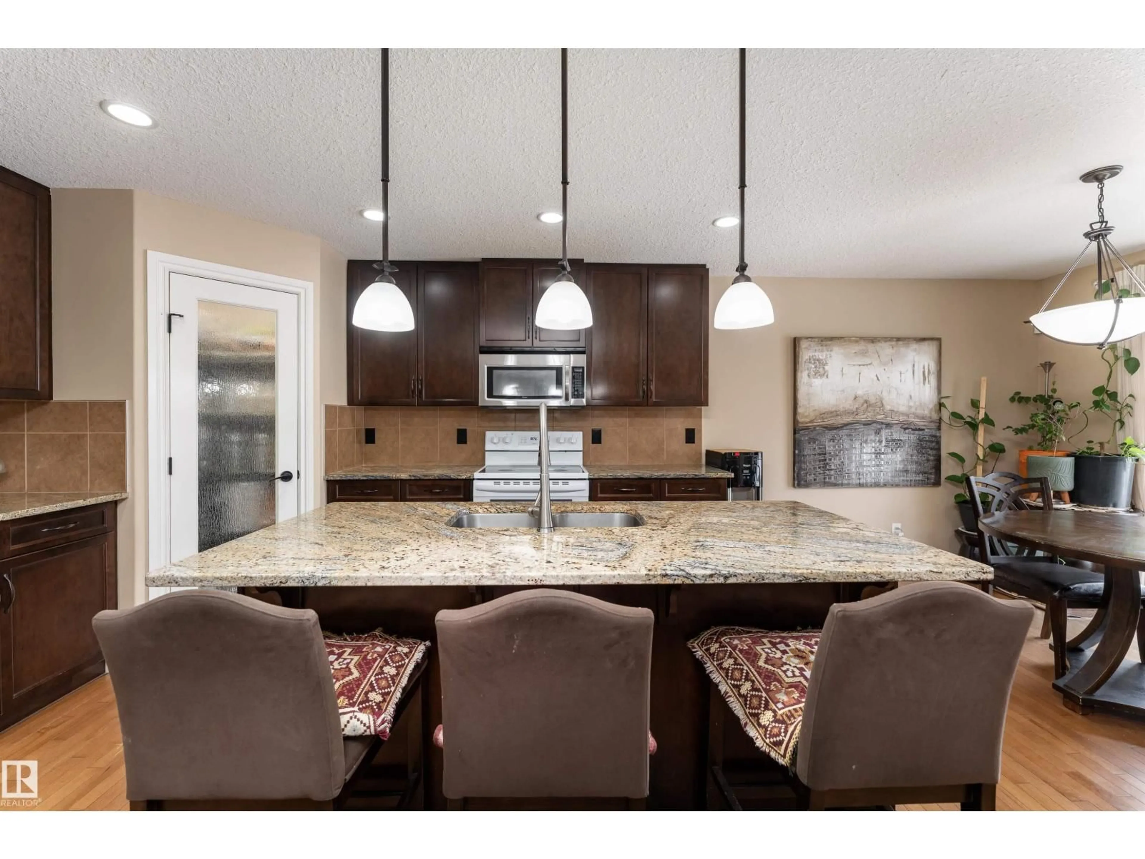 Open concept kitchen, ceramic/tile floor for 729 37A AV, Edmonton Alberta T6T0S2