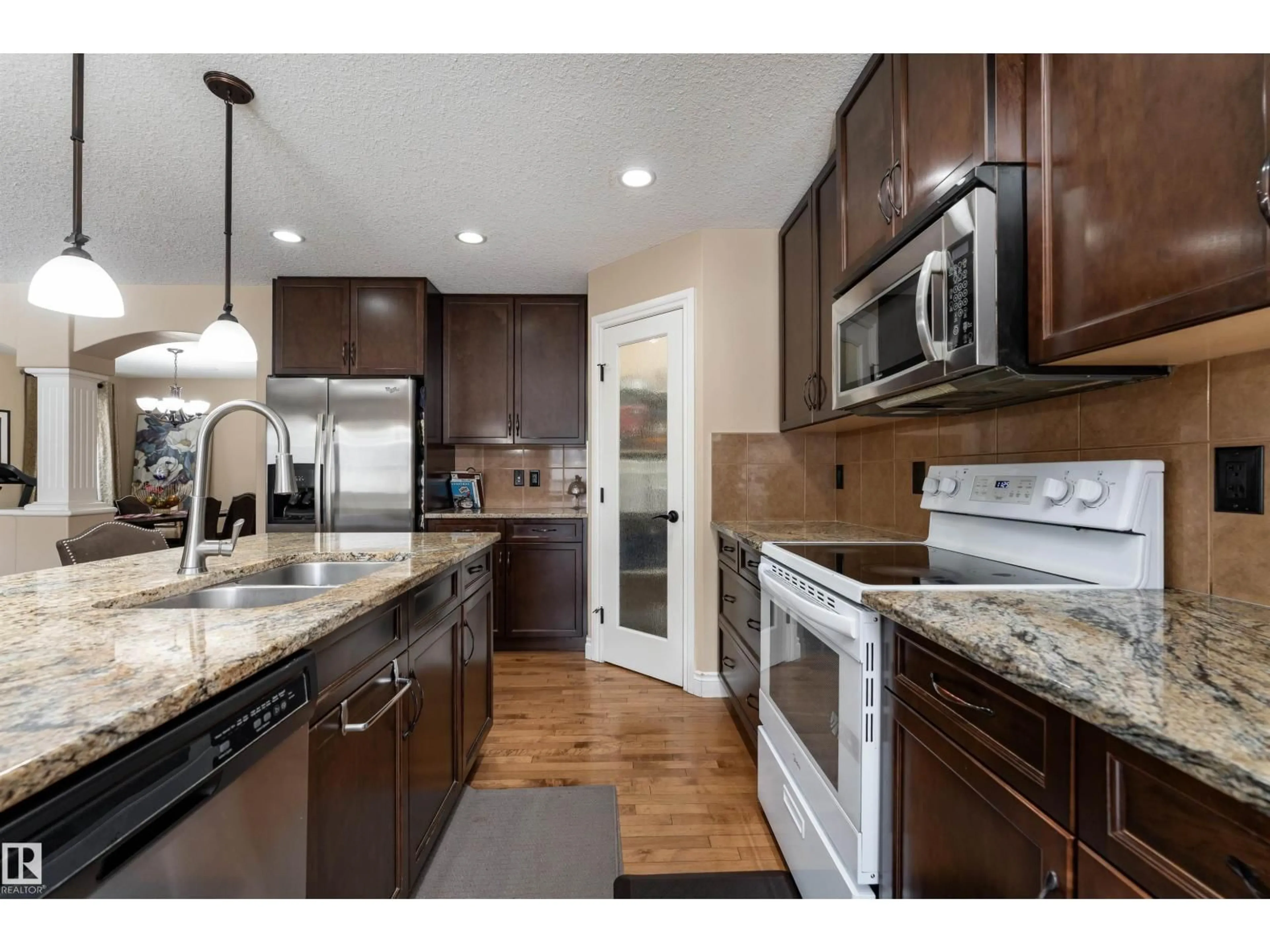 Open concept kitchen, ceramic/tile floor for 729 37A AV, Edmonton Alberta T6T0S2