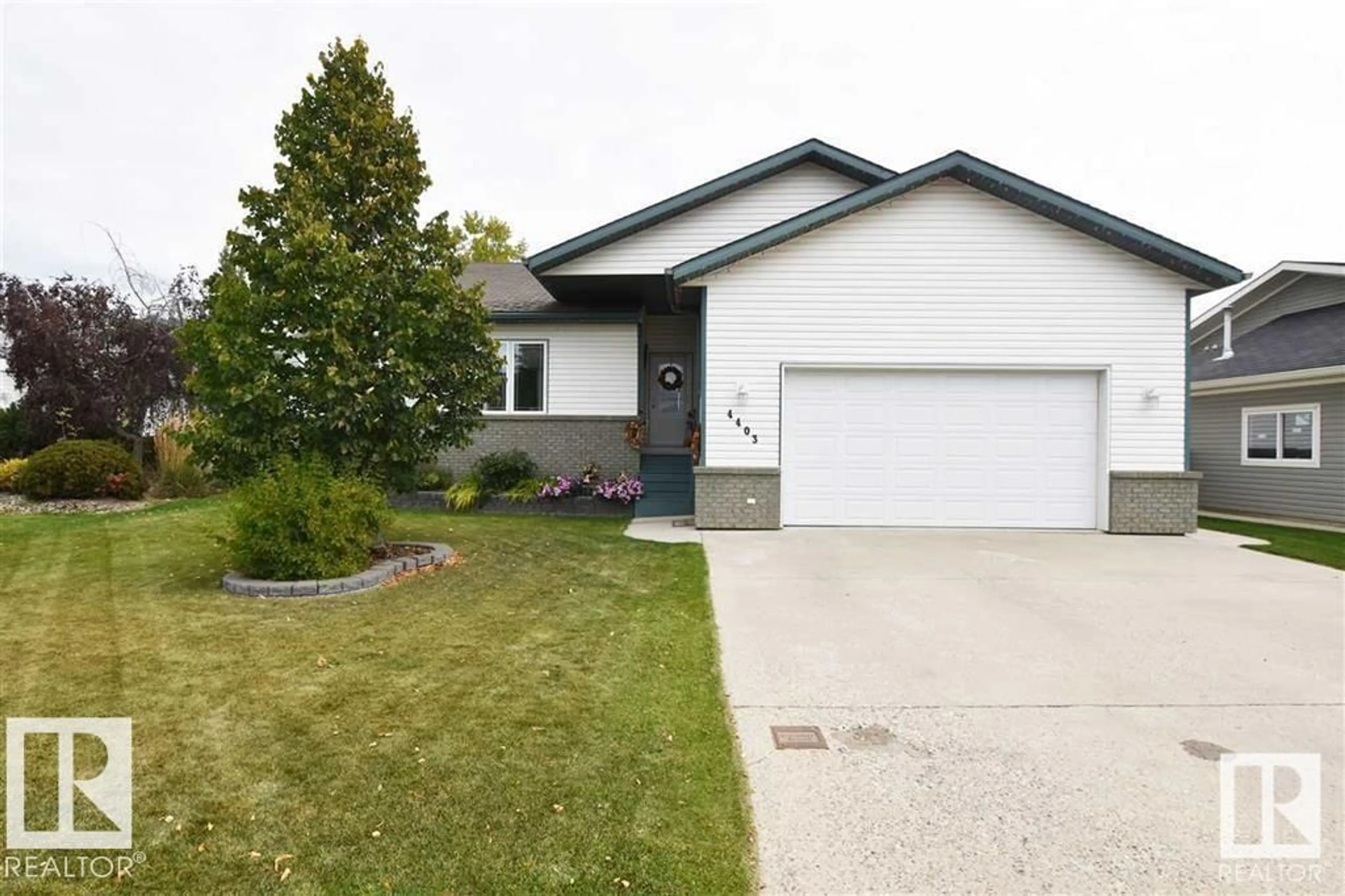 Home with vinyl exterior material, street for 4403 39 ST, Bonnyville Town Alberta T9N2P4