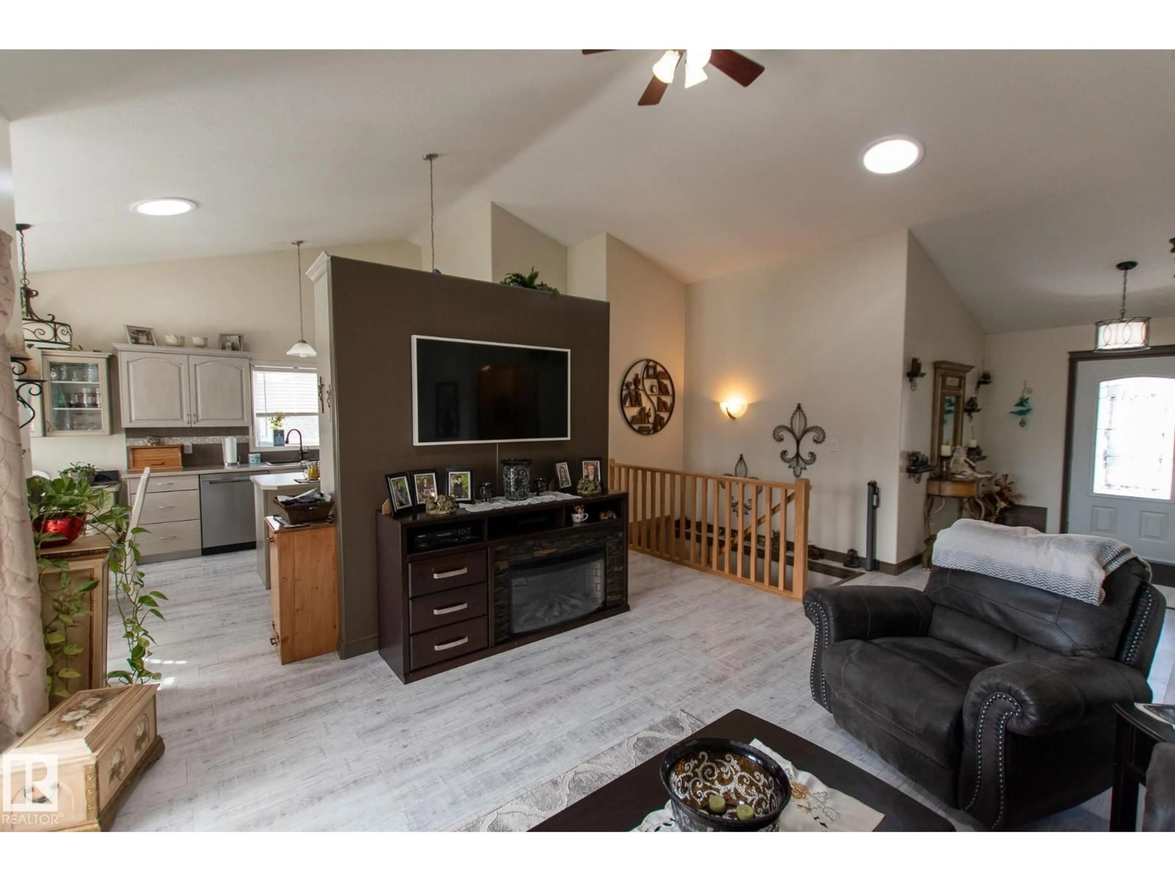 Living room with furniture, wood/laminate floor for 4403 39 ST, Bonnyville Town Alberta T9N2P4