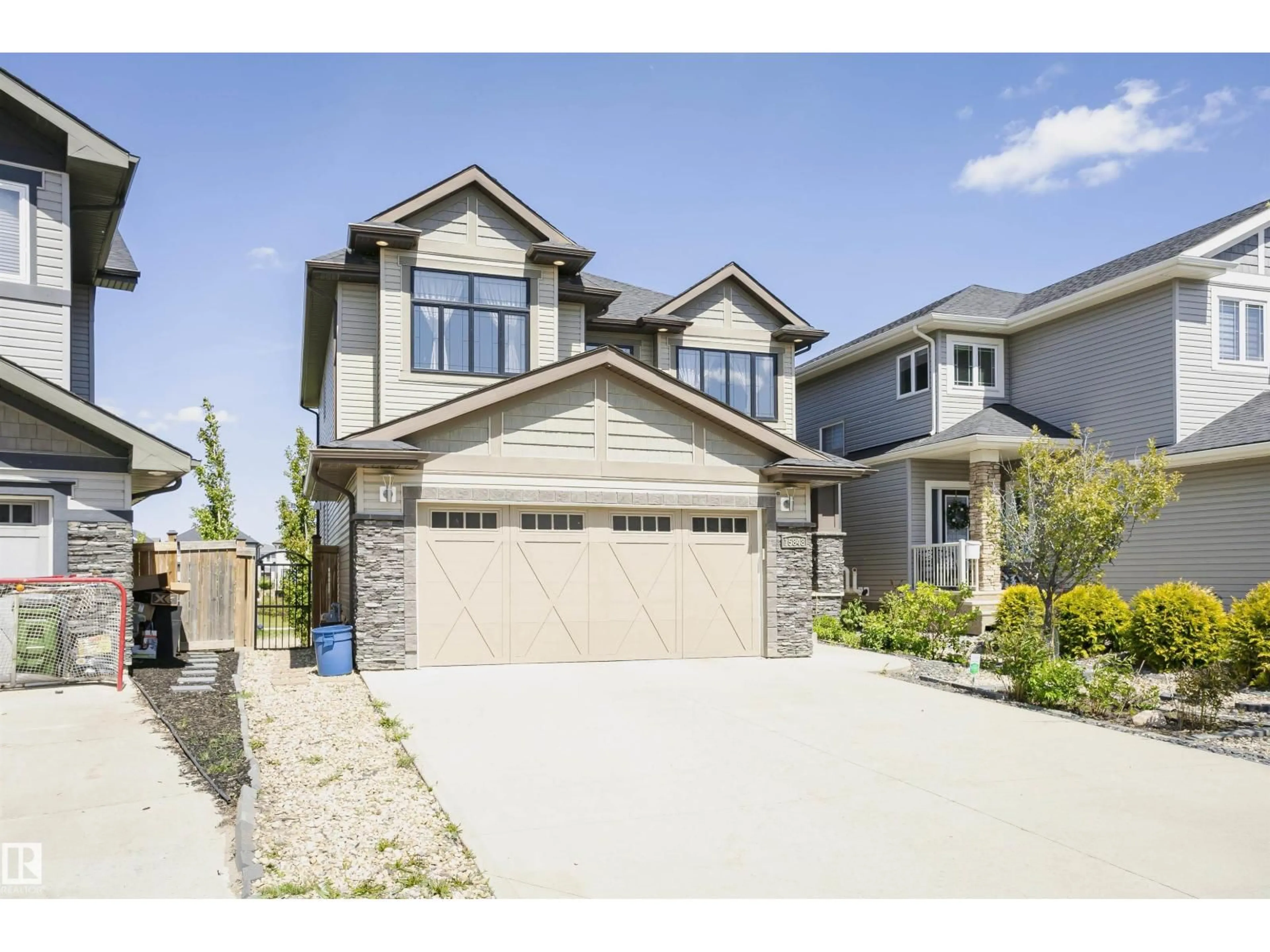 Home with vinyl exterior material, street for 15848 13 AV, Edmonton Alberta T6W2N5