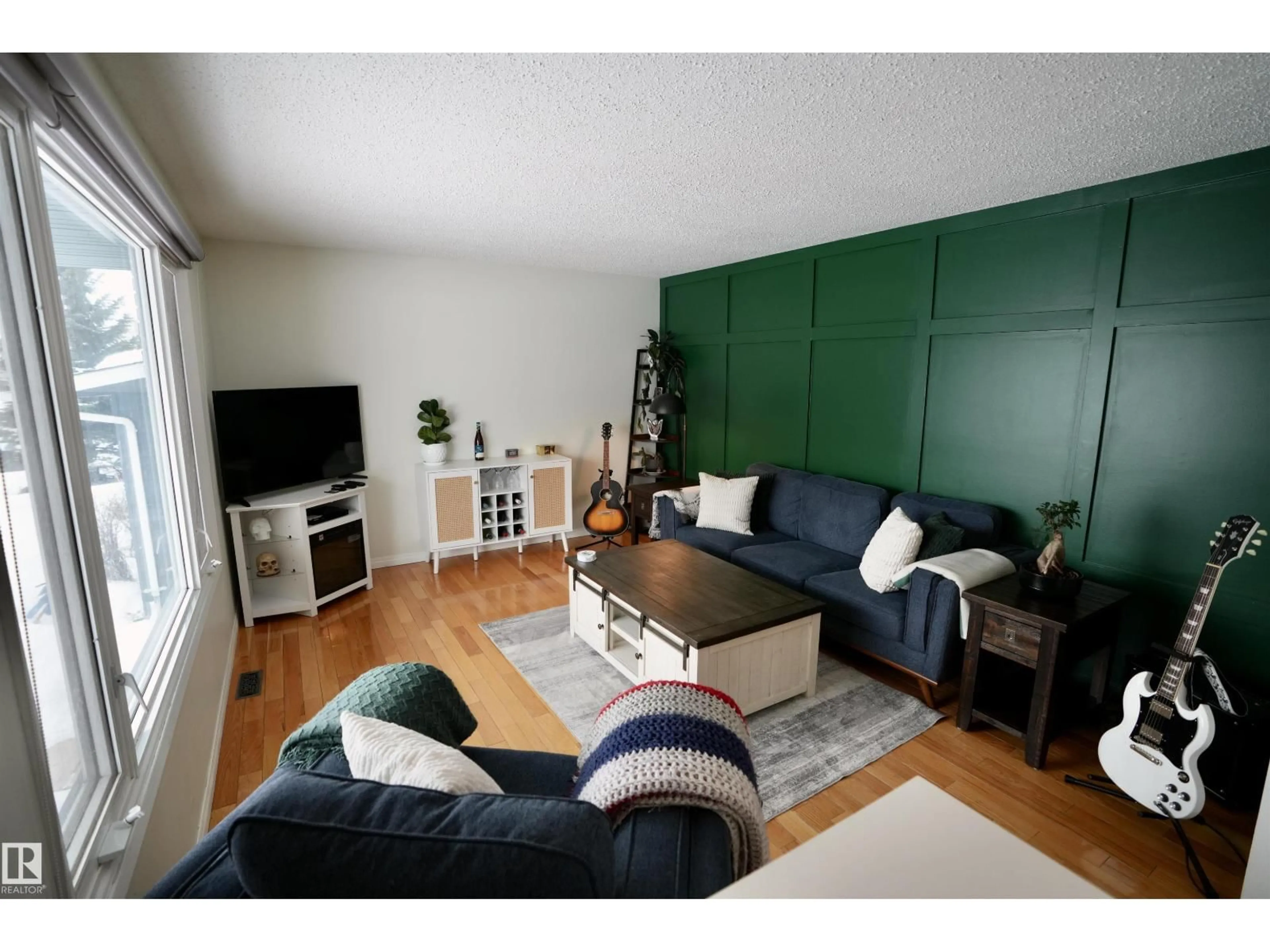 Living room with furniture, wood/laminate floor for 4410 46A ST, St. Paul Town Alberta T0A3A3