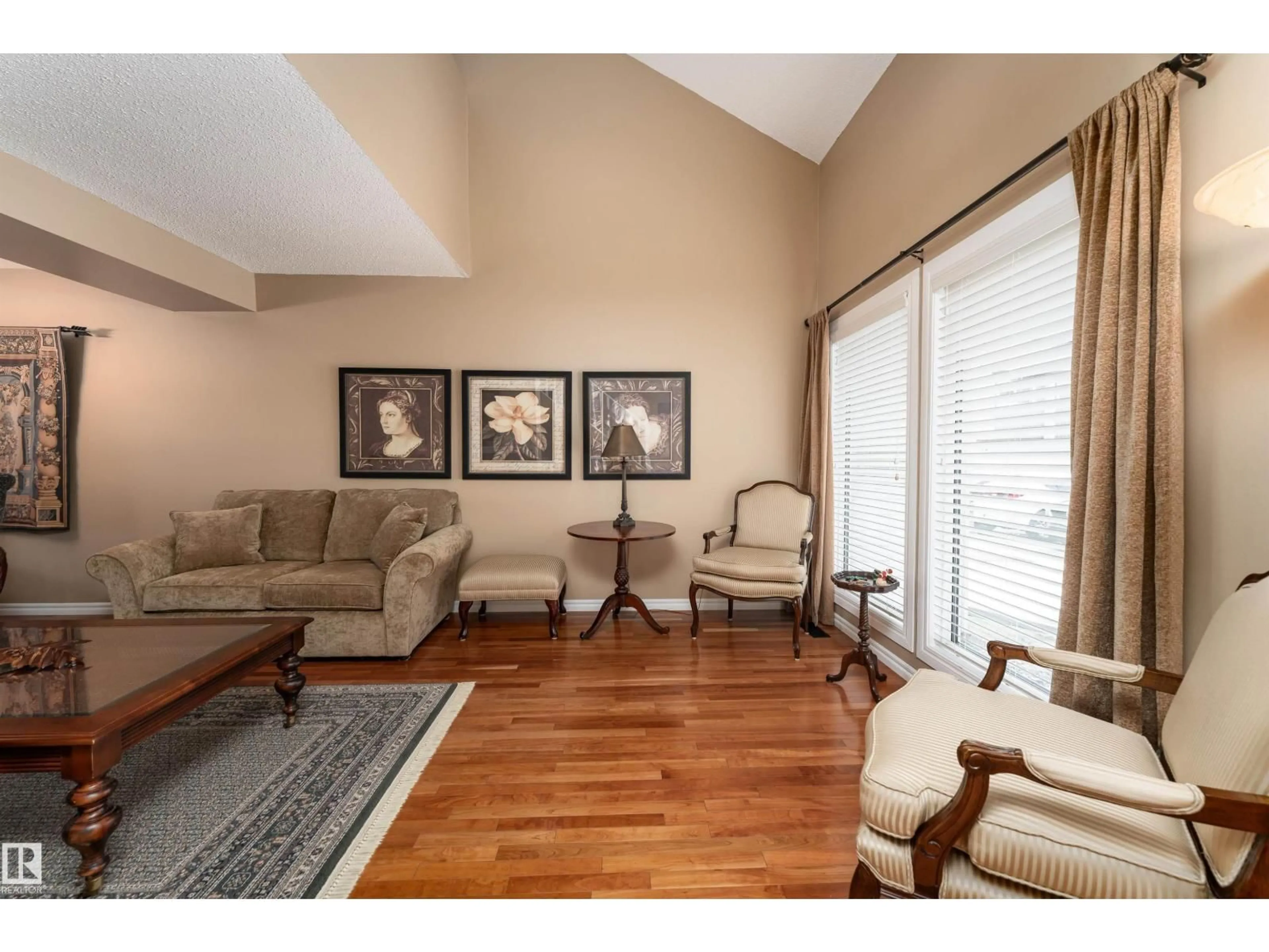 Living room with furniture, wood/laminate floor for #6 - 2020 105 ST, Edmonton Alberta T6J5J2