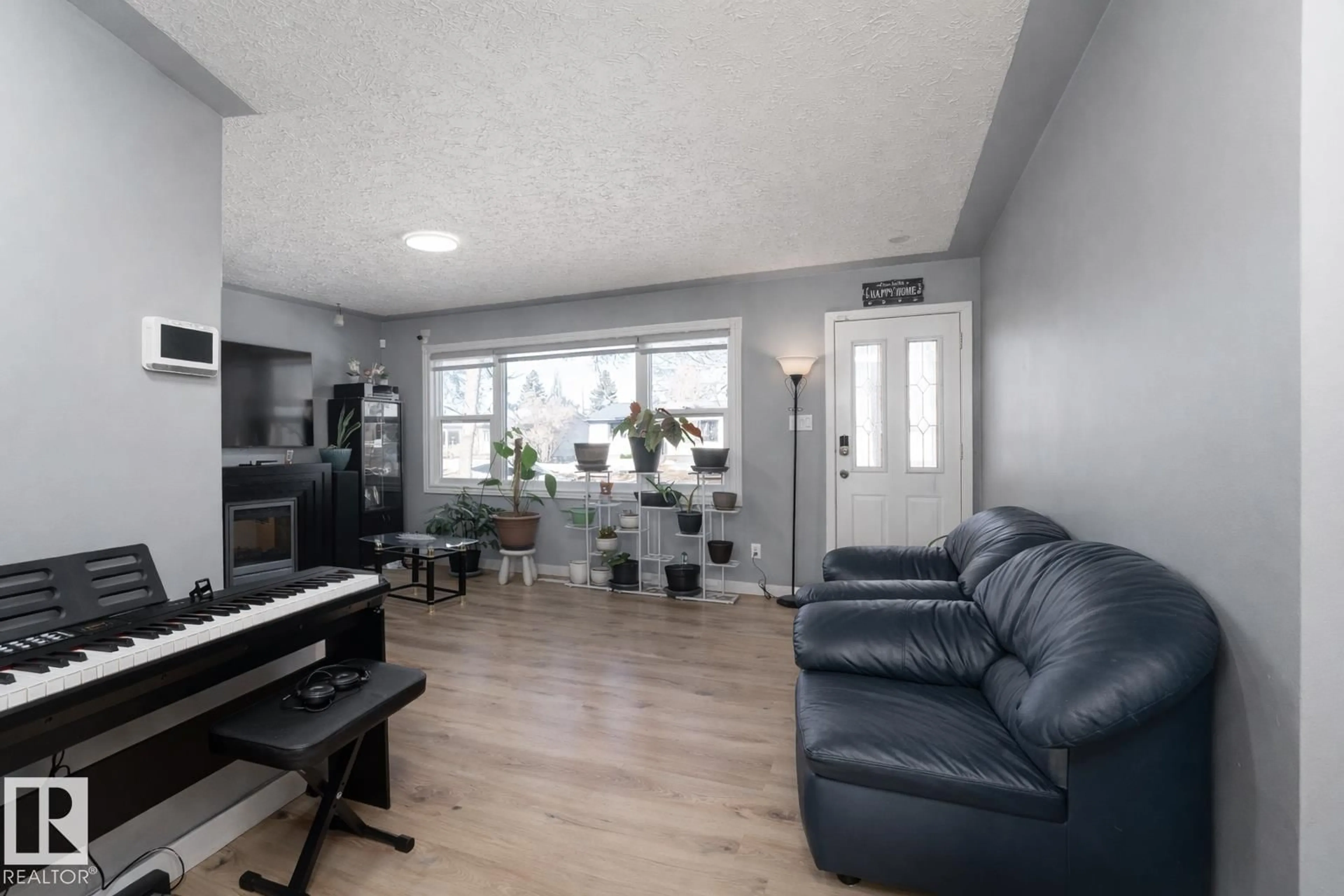 Living room with furniture, unknown for 16131 109 AV, Edmonton Alberta T5P4E5