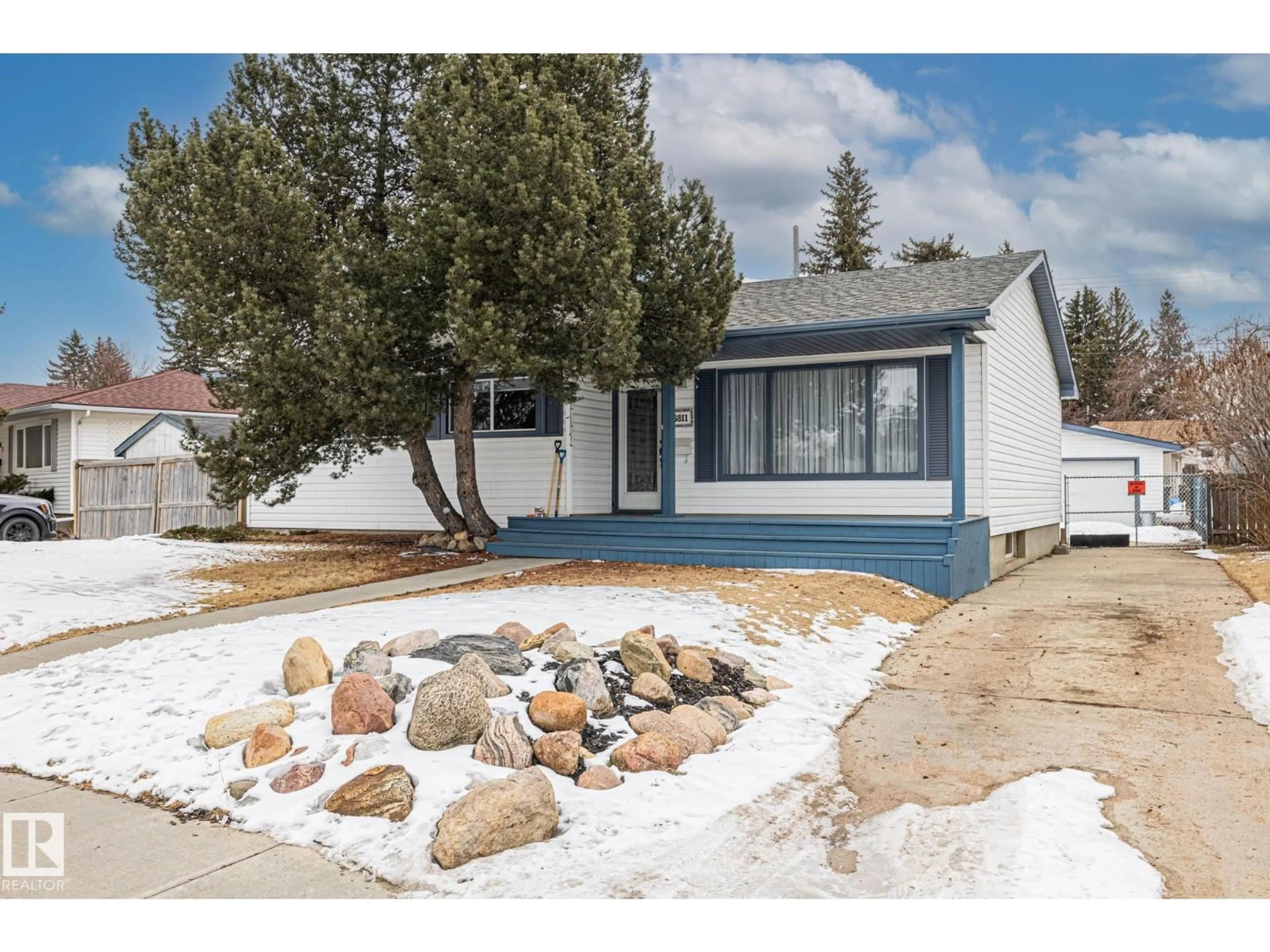 Home with vinyl exterior material, street for 6811 FULTON DR, Edmonton Alberta T6A3V7