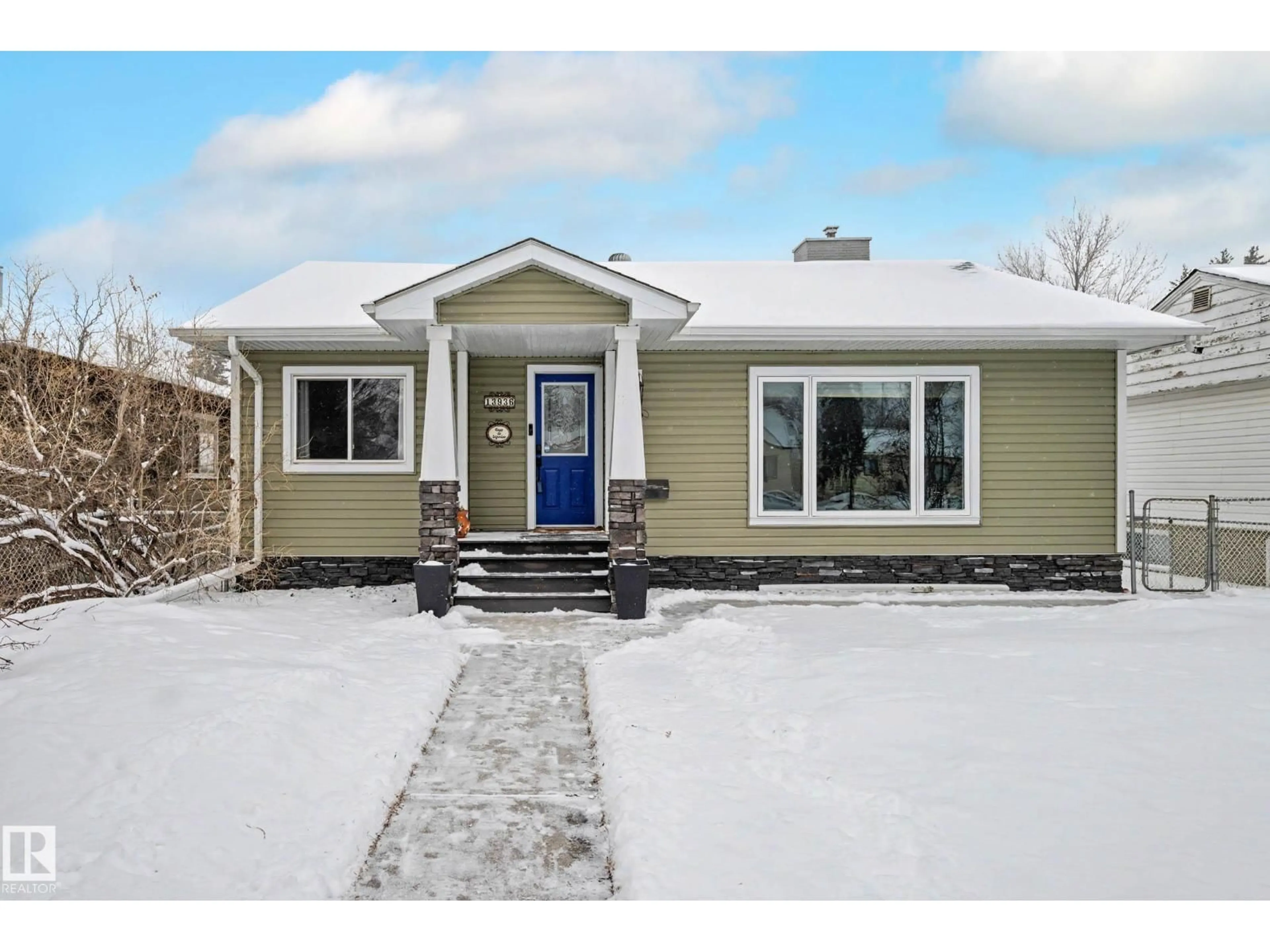 Home with vinyl exterior material, street for 13936 118 AV, Edmonton Alberta T5L2M4