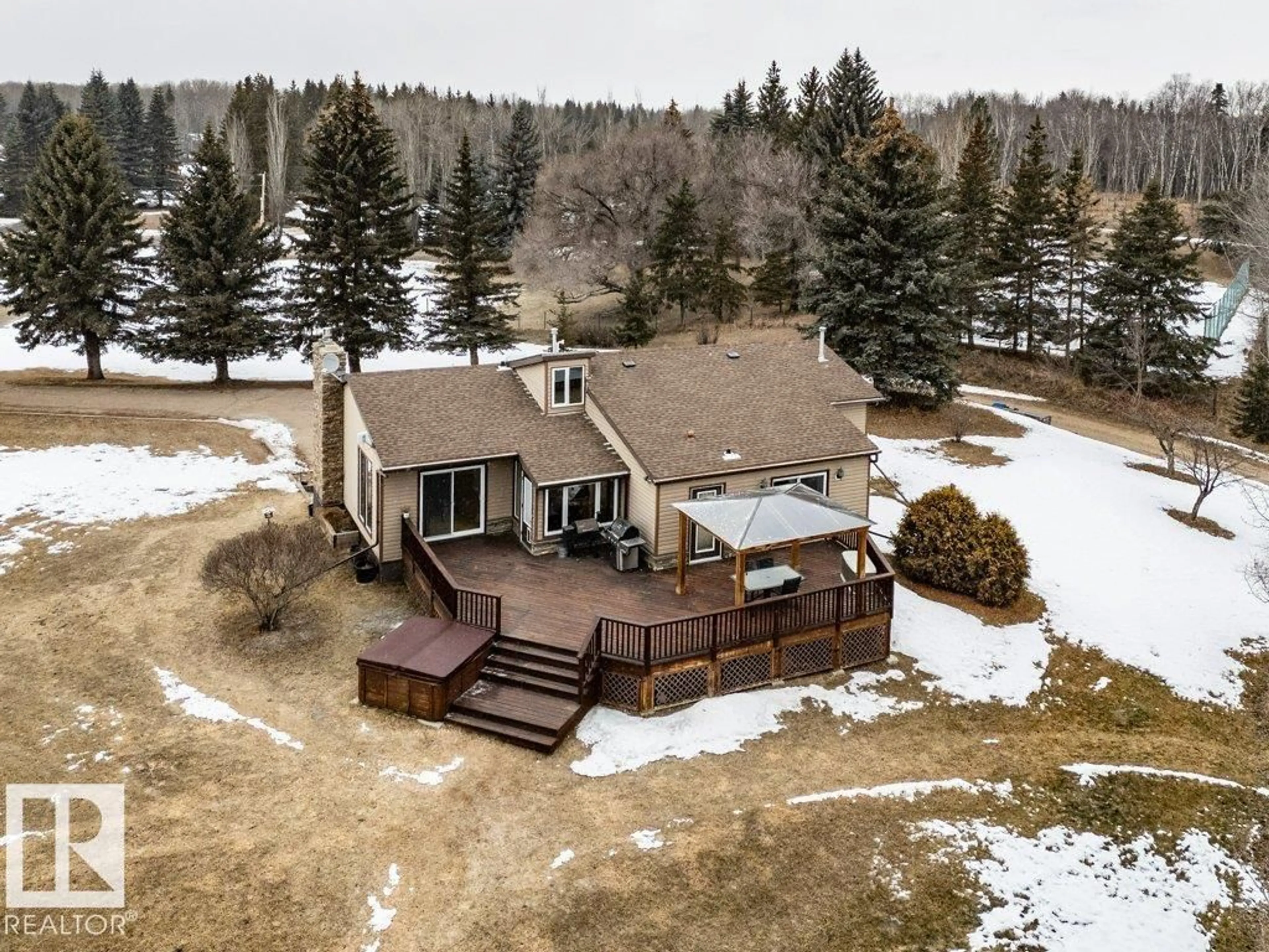 A pic from outside/outdoor area/front of a property/back of a property/a pic from drone, unknown for 8 - 26120 TWP RD 511, Rural Parkland County Alberta T7Y1B8
