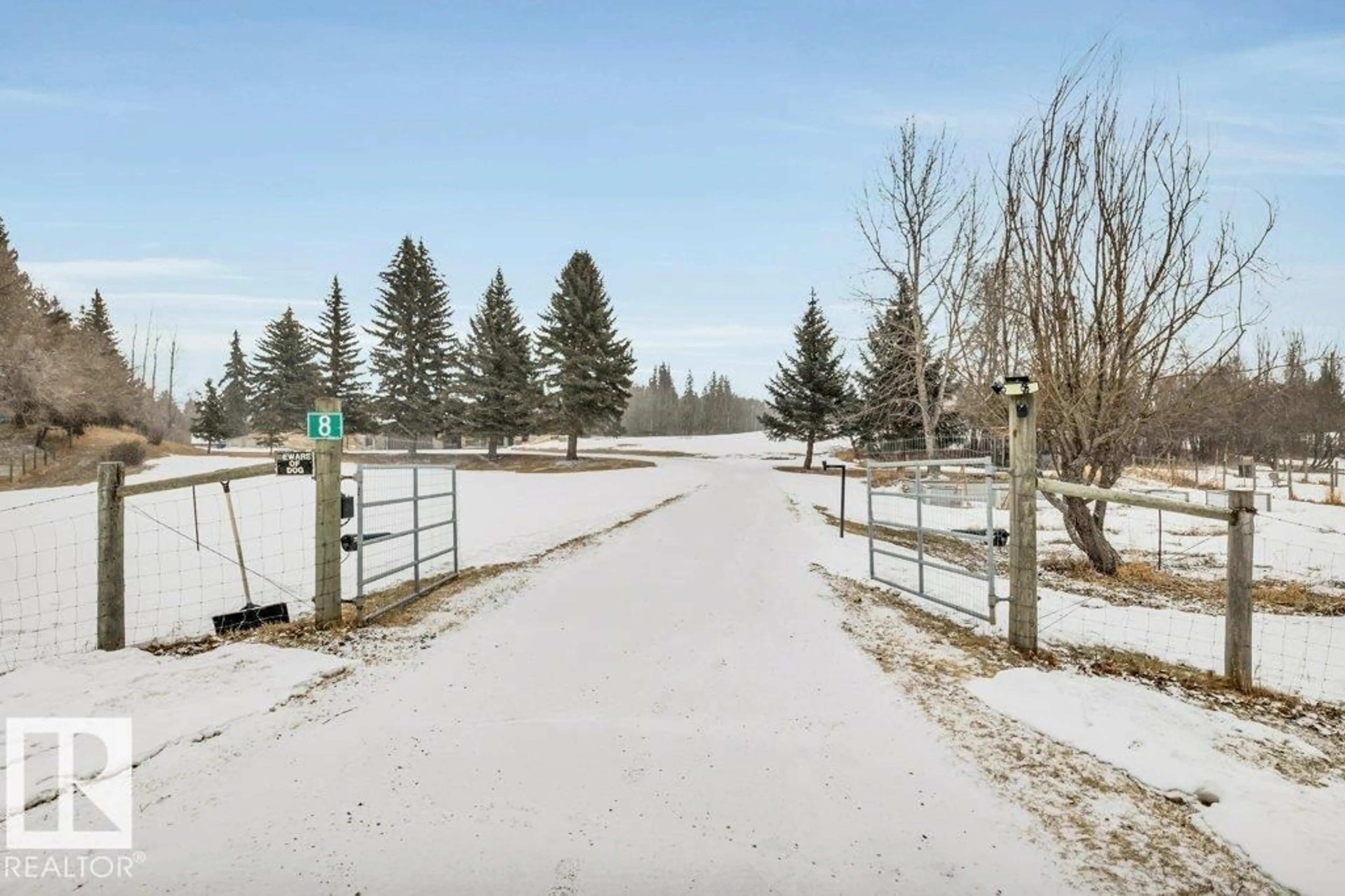 A pic from outside/outdoor area/front of a property/back of a property/a pic from drone, street for 8 - 26120 TWP RD 511, Rural Parkland County Alberta T7Y1B8