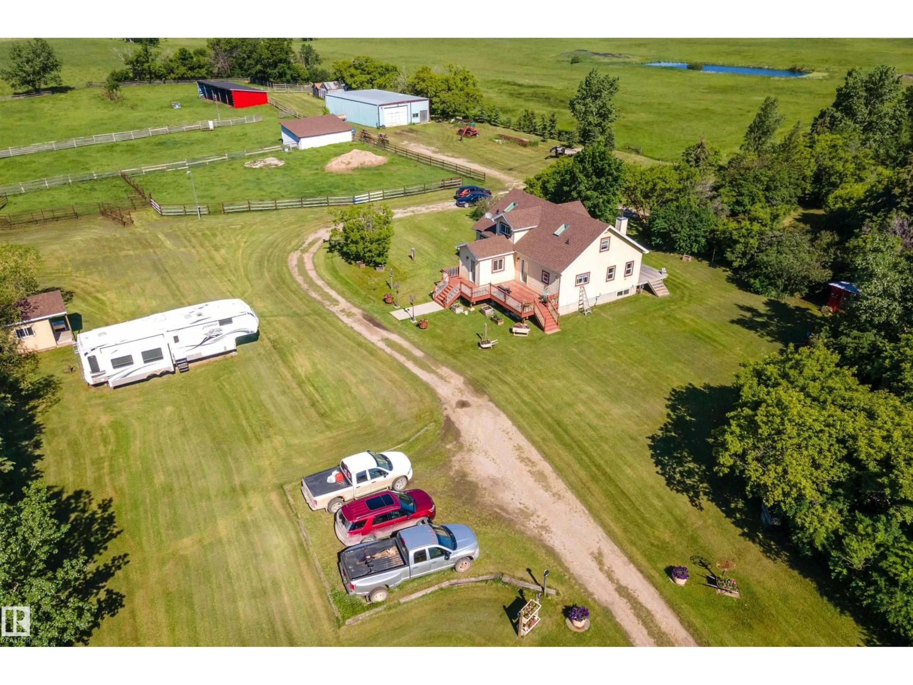 A pic from outside/outdoor area/front of a property/back of a property/a pic from drone, unknown for 48114 RGE RD 262, Rural Leduc County Alberta T0C1Z0