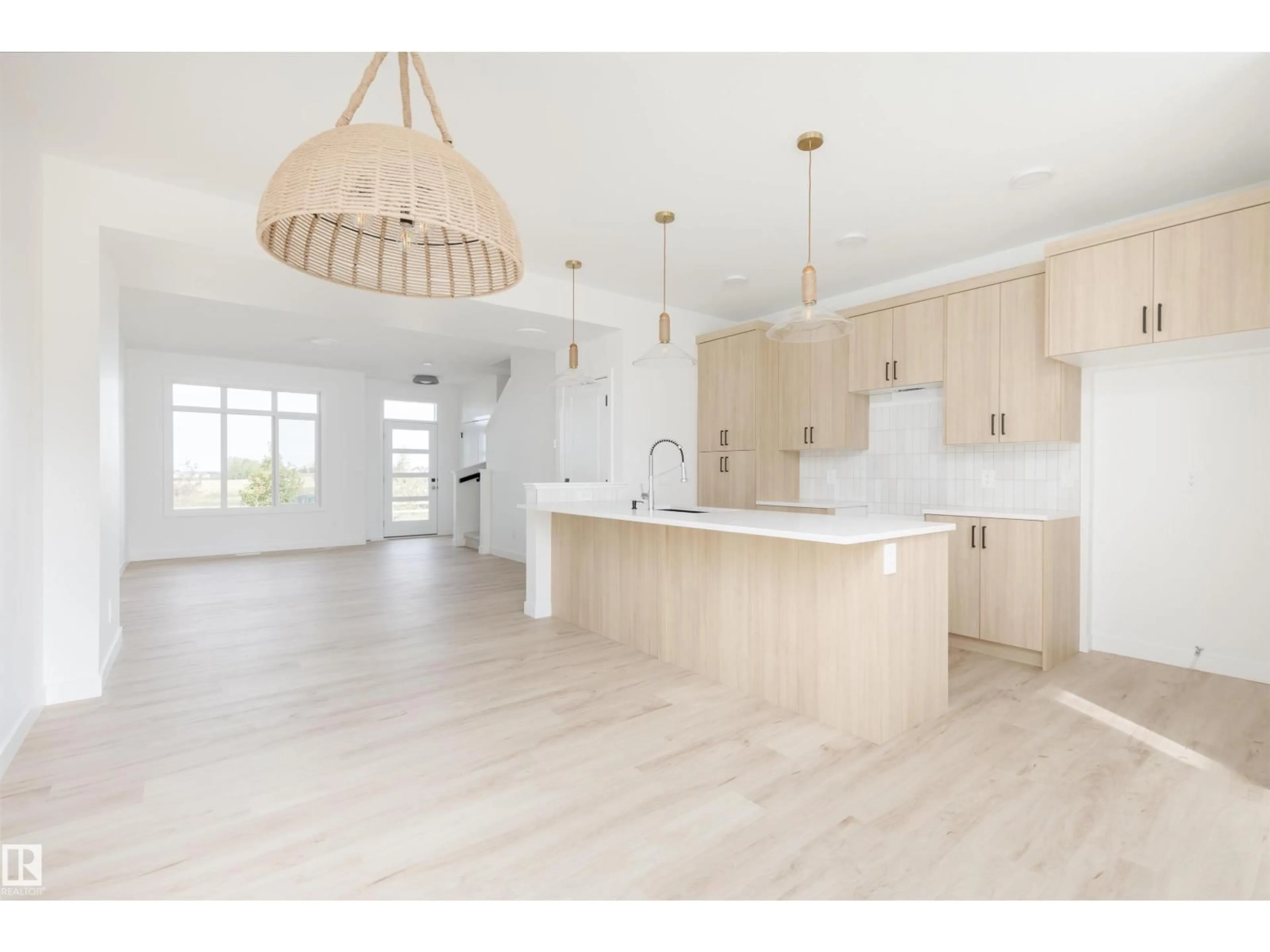 Open concept kitchen, wood/laminate floor for 2638 62 ST, Edmonton Alberta T6X0K4