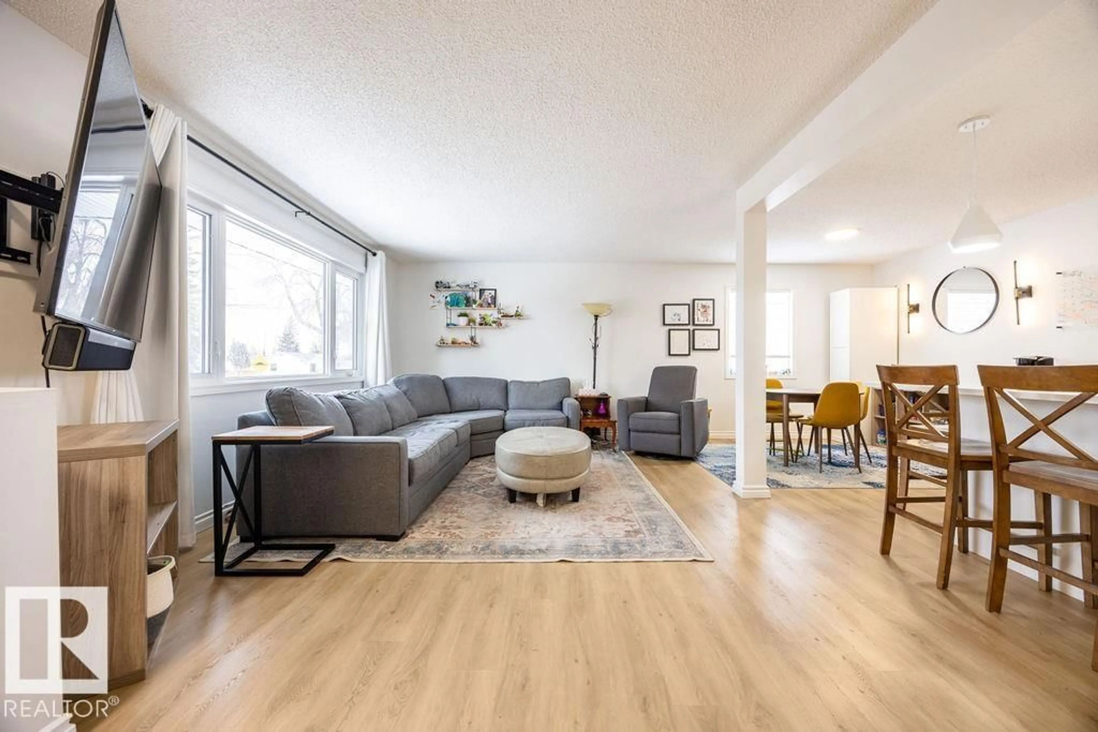 Living room with furniture, wood/laminate floor for 16005 83 AV, Edmonton Alberta T5R3V3