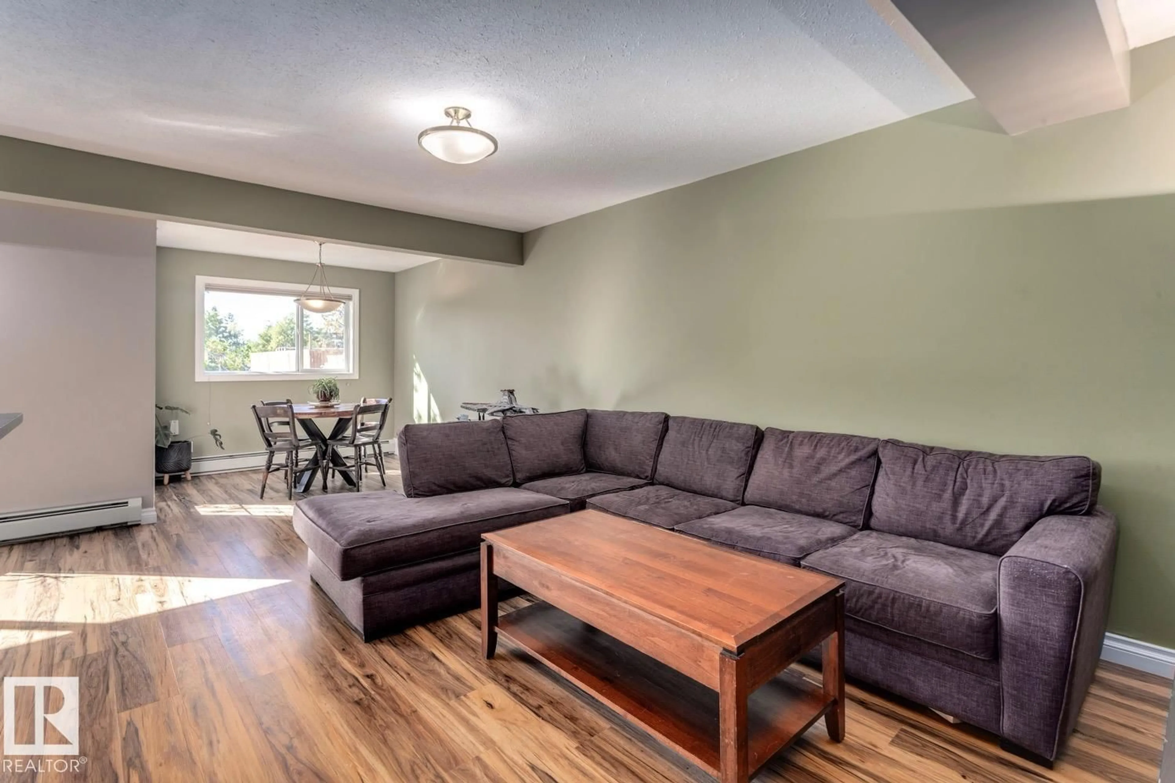 Living room with furniture, wood/laminate floor for #209 - 11033 127 ST, Edmonton Alberta T5M0T3