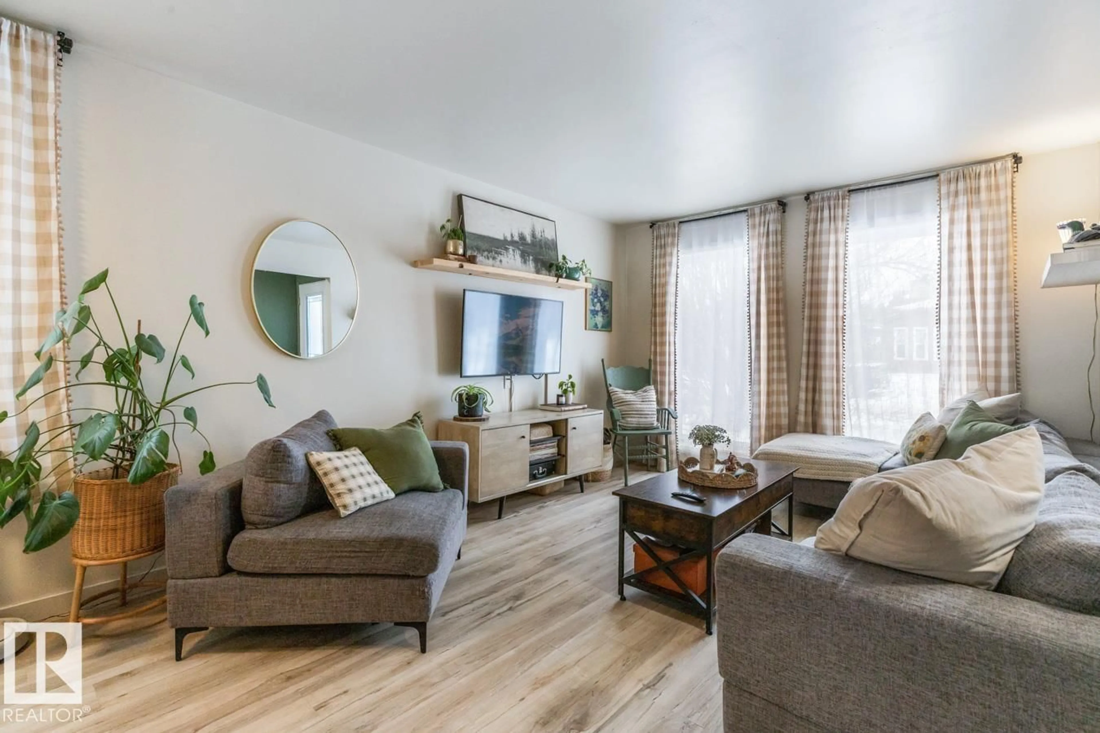 Living room with furniture, wood/laminate floor for 4333 38 ST, Edmonton Alberta T6L5A6