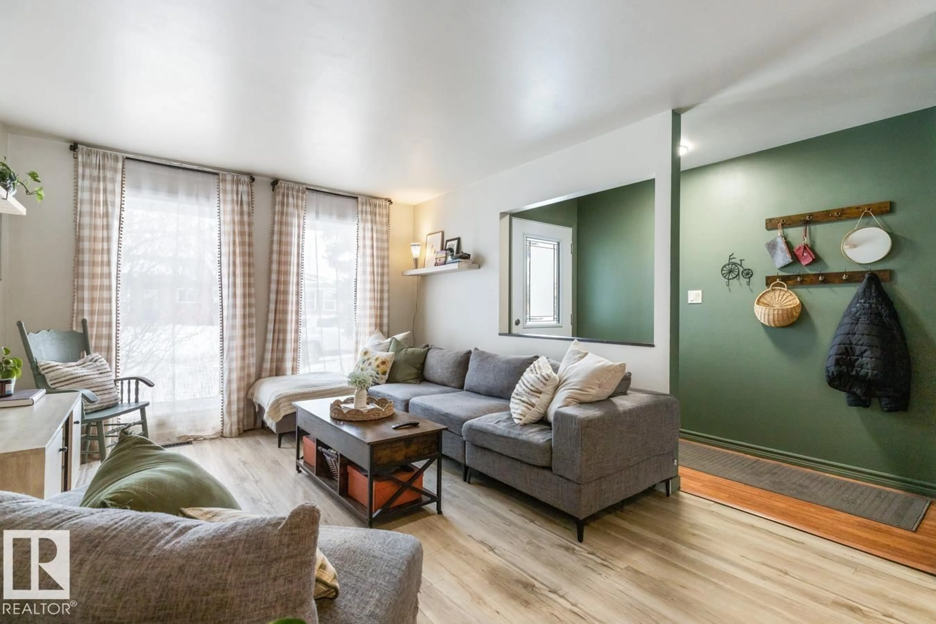 Living room with furniture, wood/laminate floor for 4333 38 ST, Edmonton Alberta T6L5A6