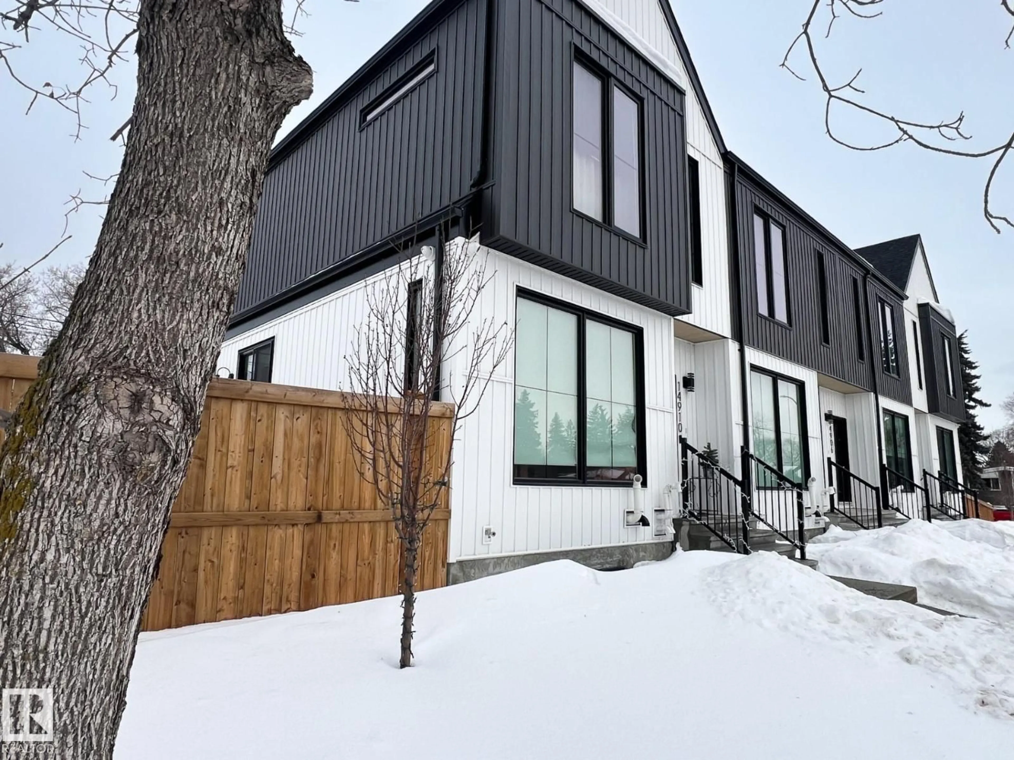 Home with vinyl exterior material, street for 14904 109 AV, Edmonton Alberta T5P1M6