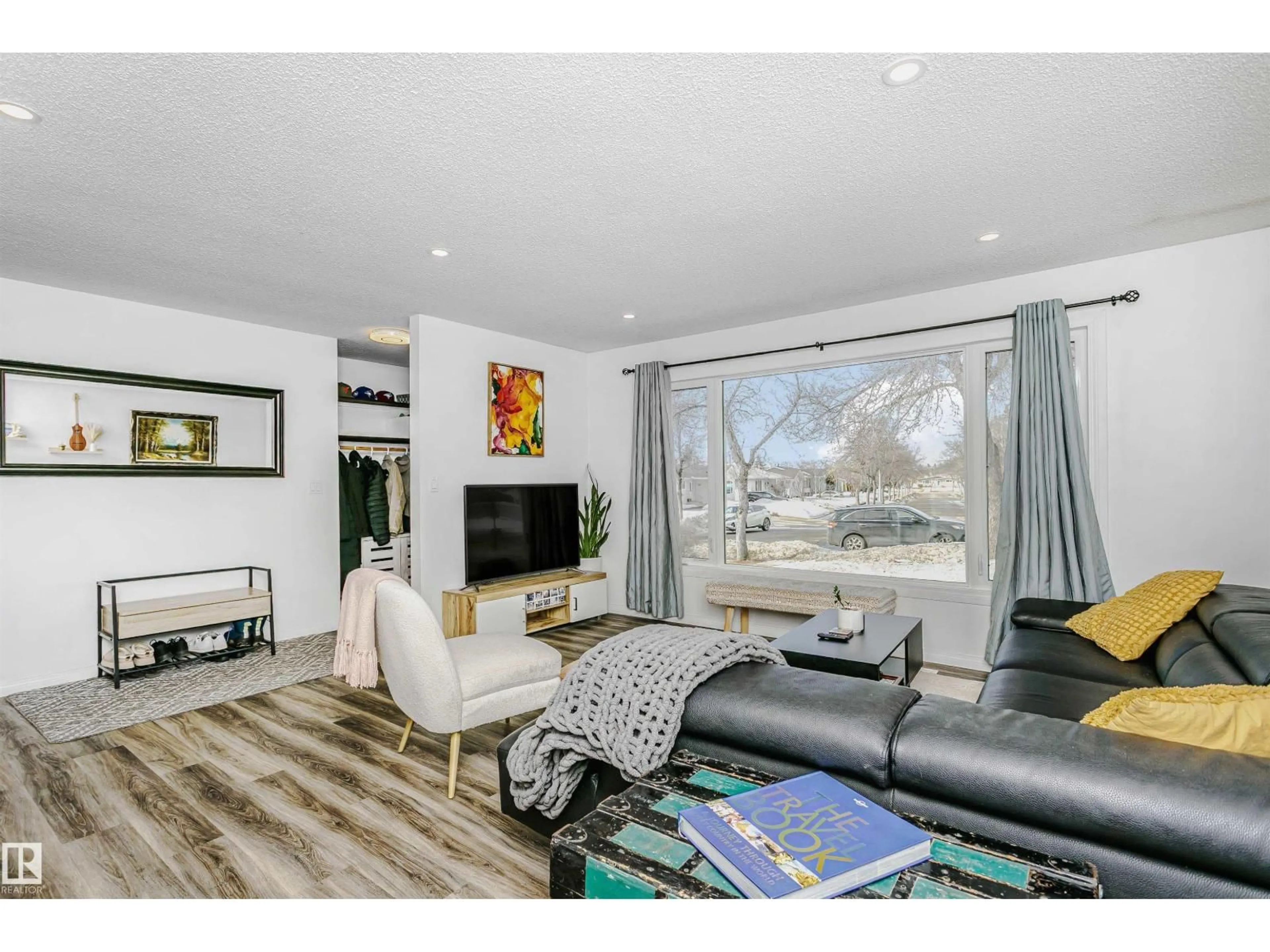 Living room with furniture, wood/laminate floor for 8841 92 AV, Fort Saskatchewan Alberta T8L1A3