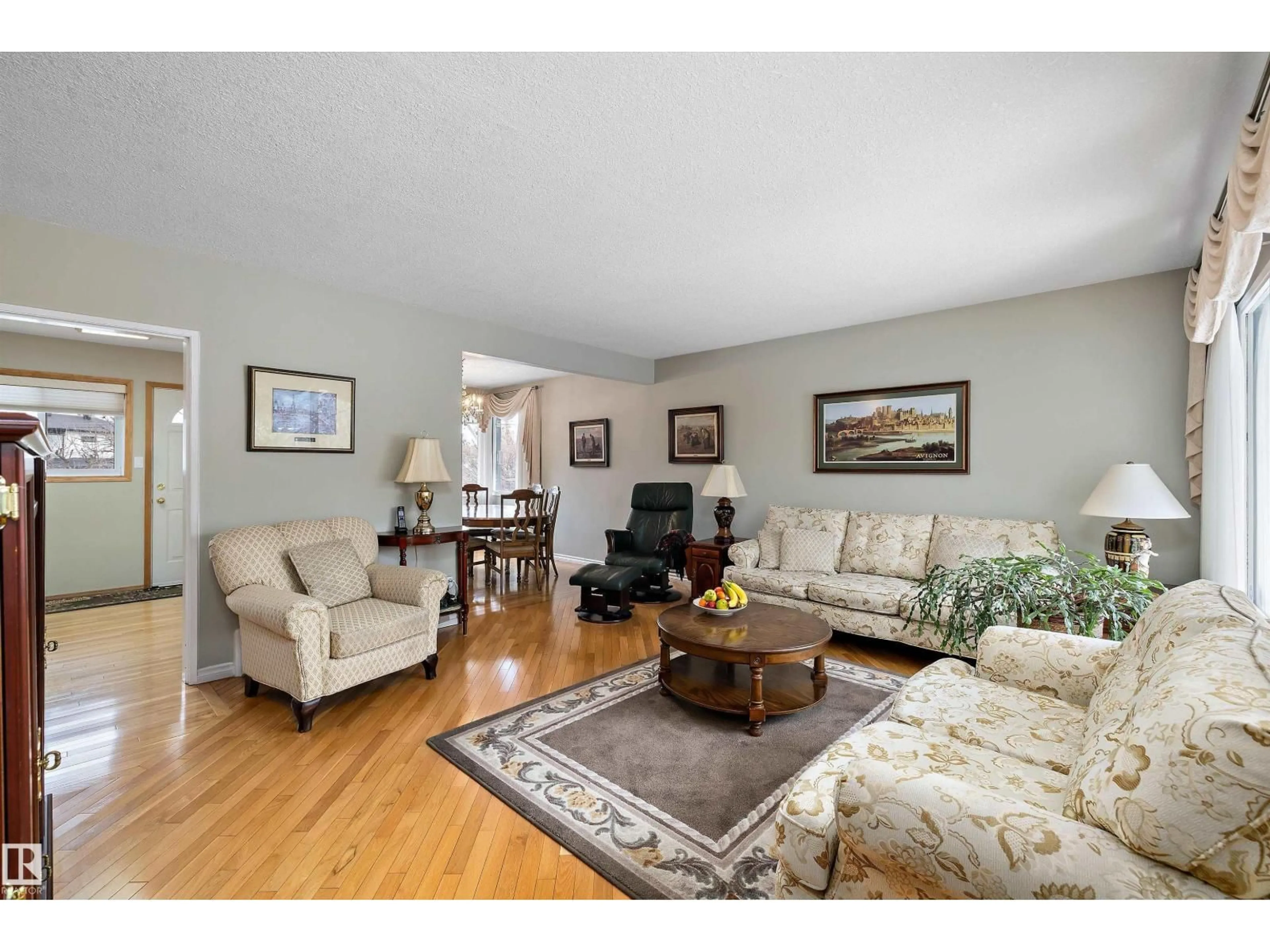 Living room with furniture, wood/laminate floor for NW - 10815 131 ST, Edmonton Alberta T5M1B3