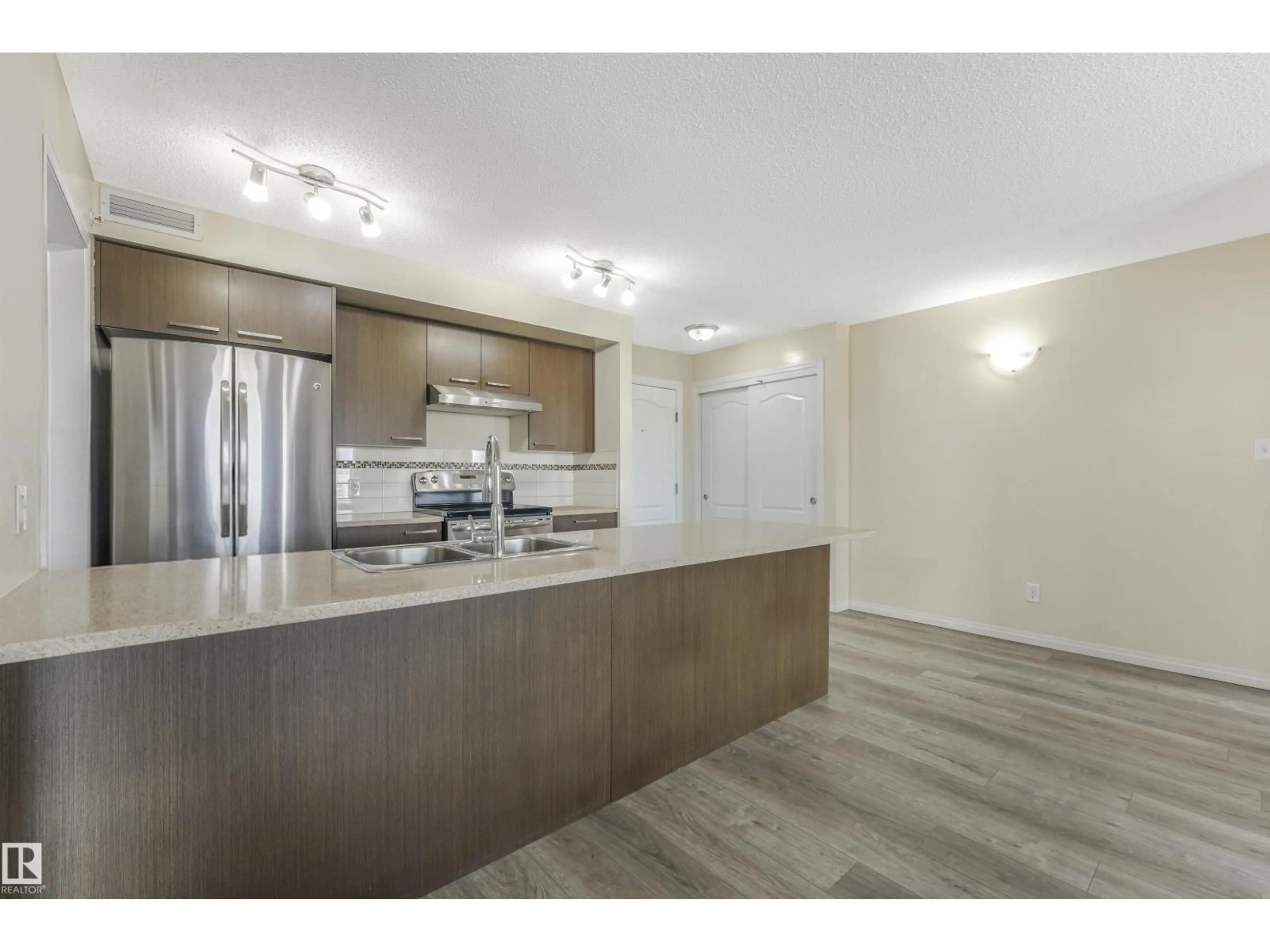 Open concept kitchen, wood/laminate floor for 2405 SOUTH TERWILLEGAR DR, Edmonton Alberta T6R0M2